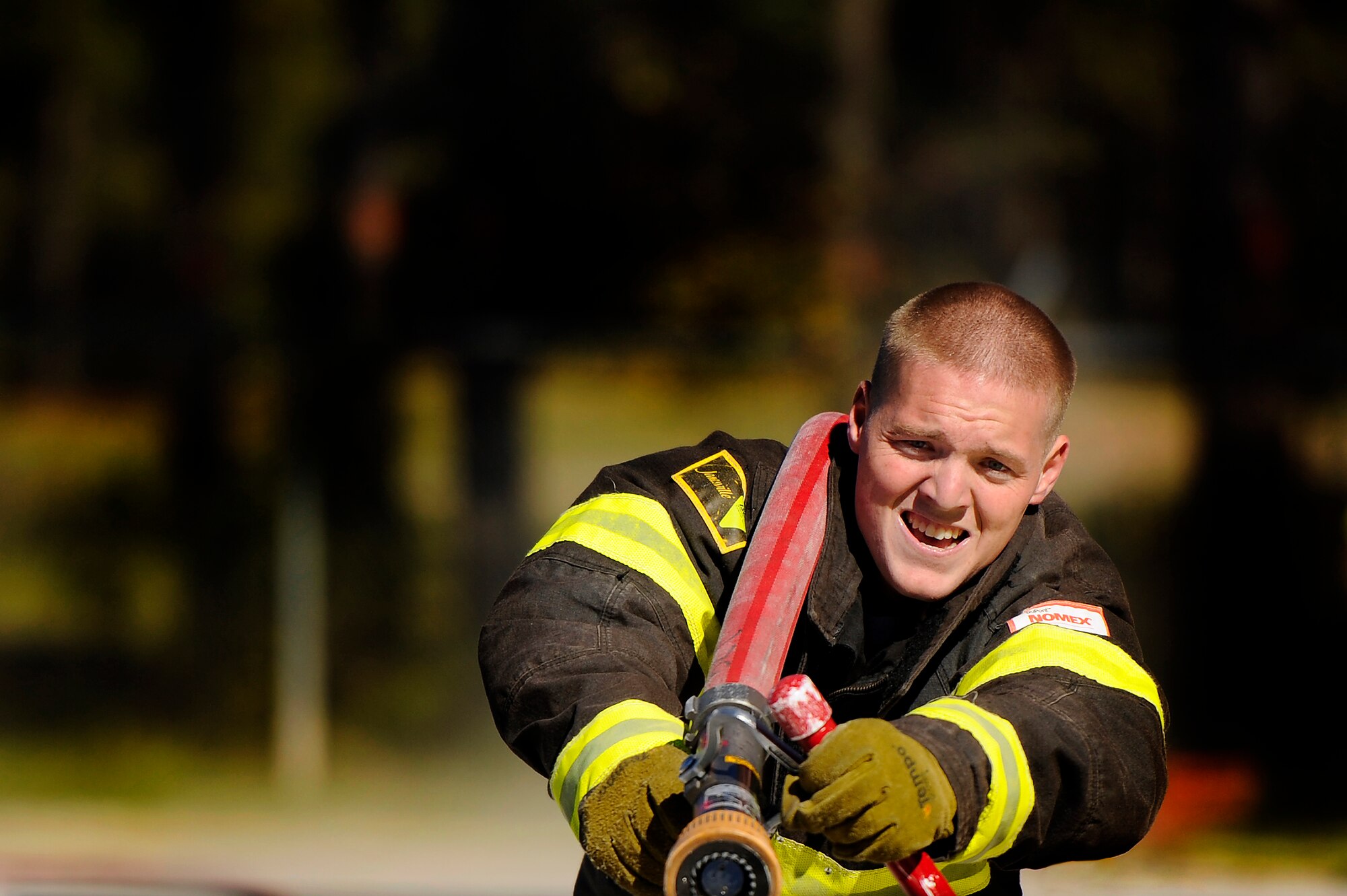 A Team Shaw 20th Civil Engineer Squadron firefighter works hard to drag a fire hose full of water during a training session in preparation for the Scott Firefighter Combat Challenge worldwide competition in Myrtle Beach, S.C. Oct. 29, 2012. The competition took place Nov. 12 and 17, 2012 and Team Shaw’s firefighters took  6th place amongst the top 20 teams in the team portion of the competition. (U.S. Air Force photo by Staff Sgt. Kenny Holston/Released)