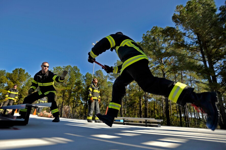 Team Shaw’s 20th Civil Engineer Squadron firefighters participate as a team in relay training in preparation for the Scott Firefighter Combat Challenge worldwide competition in Myrtle Beach, S.C. Oct. 29, 2012. The competition took place Nov. 12 and 17, 2012 and Team Shaw’s firefighters took 6th place amongst the top 20 teams in the team portion of the competition. (U.S. Air Force photo by Staff Sgt. Kenny Holston/Released) 