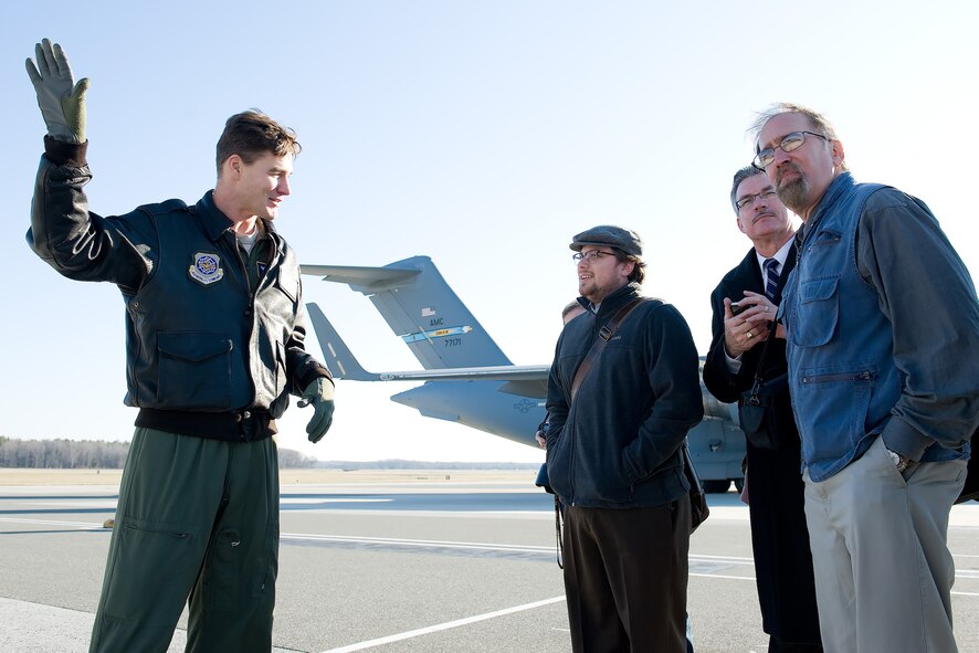 Lt. Col. Erin Meinders, director of operations with the 3rd Airlift Squadron, answers questions from media representatives pertaining to the C-17 Globemaster III Jan. 7, 2013, at Dover Air Force Base, Del. Meinders briefed media representatives on the C-17 aircraft and its capabilities. (U.S. Air Force photo/Roland Balik)