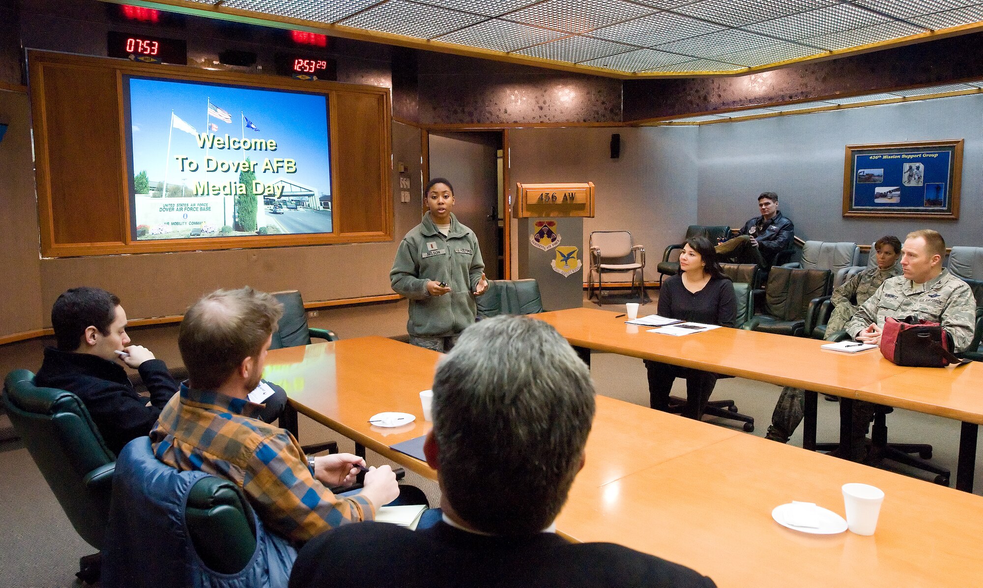 Second Lt. Remoshay Nelson, chief of media with the 436th Airlift Wing Public Affairs office, briefs media representatives during the welcome briefing Jan. 7, 2013, at Dover Air Force Base, Del. Media representatives met base leadership and participated in an orientation flight and base tour to get a better understanding of Dover AFB's mission. (U.S. Air Force photo/Roland Balik)