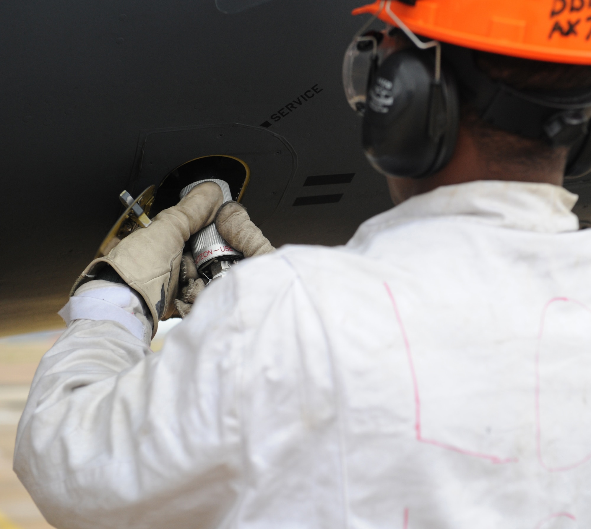 Senior Airman Princeton Drake, 20th Aircraft Maintenance Unit crew chief, connects a liquid oxygen servicing hose to a filter valve on Barksdale Air Force Base, La., Jan. 8. Liquid oxygen is transferred into three converters, each capable of holding up to 25 liters on the B-52H Stratofortress. The liquid oxygen is used to assist aircrew in breathing during flight. (U.S. Air Force photo/Airman 1st Class Benjamin Gonsier)
