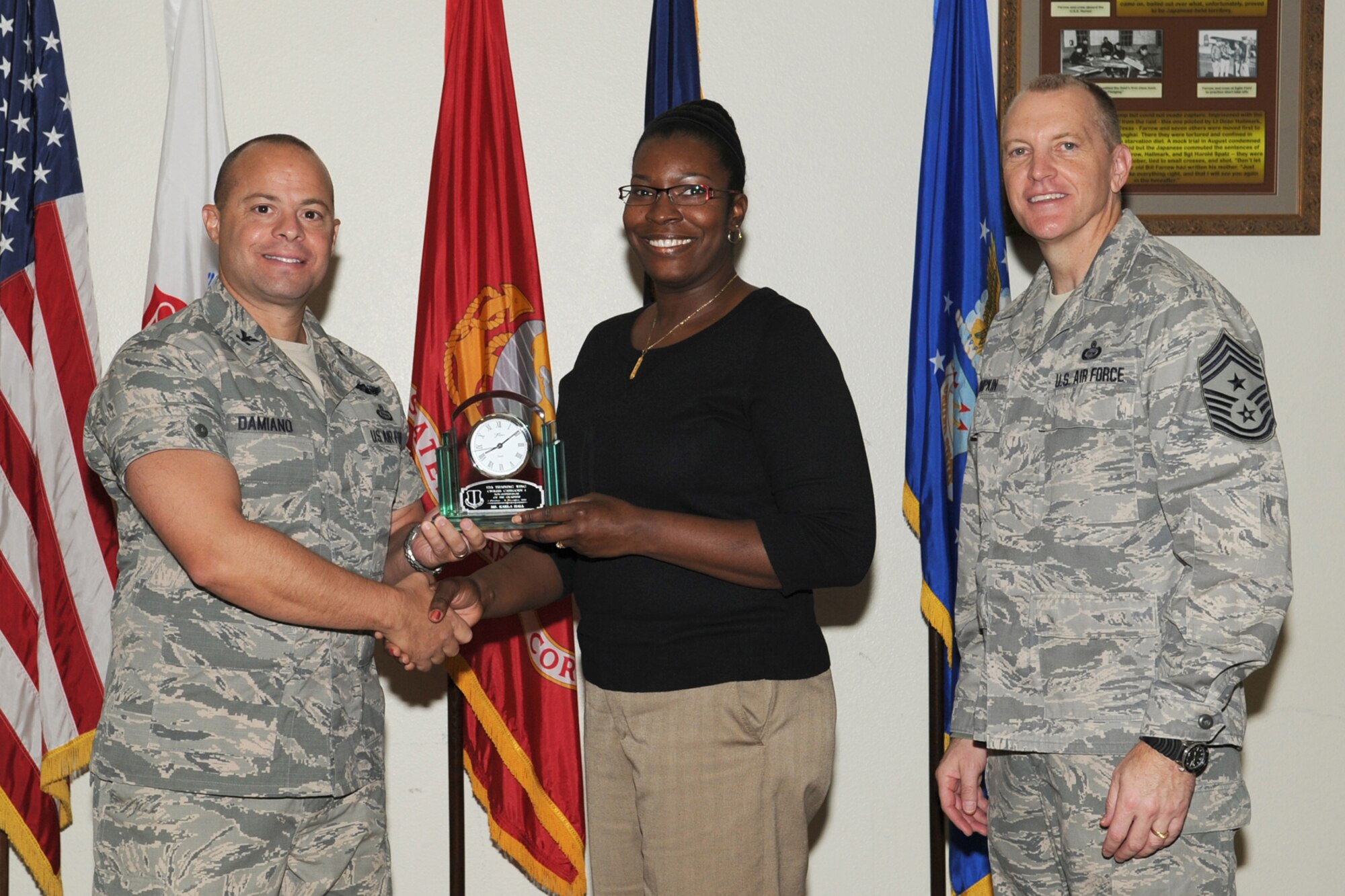 GOODFELLOW AIR FORCE BASE, Texas-- Col. Mark Damiano, 17th Training Wing Commander and Chief Master Sgt. Scott Lumpkin, 17th TRW Command Chief, present the 17th Training Wing Civilian of the Quarter Category I to Karla Hall, 17th Medical Operations Squadron, during the wing quarterly awards ceremony, here, Jan. 8,  (U.S. Air Force photo/Staff Sgt. Laura R. McFarlane)