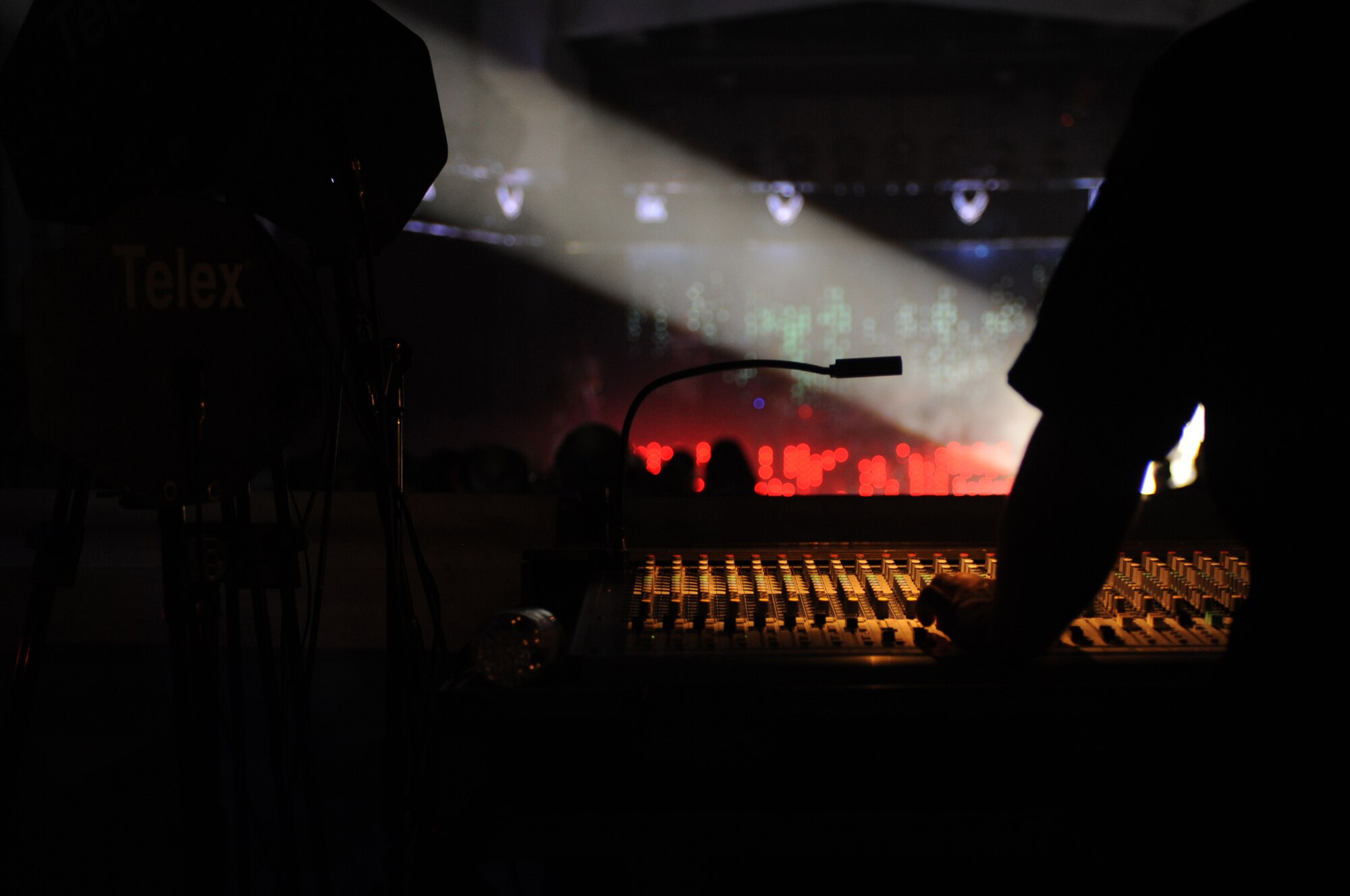 Audio engineers adjust lighting and sound during a Tops in Blue performance on Seymour Johnson Air Force Base, N.C., Jan. 7, 2013. Tops in Blue have performed for military personnel and their families throughout the world for 58 years. (U.S. Air Force photo/Airman 1st Class Mariah Tolbert/Released)