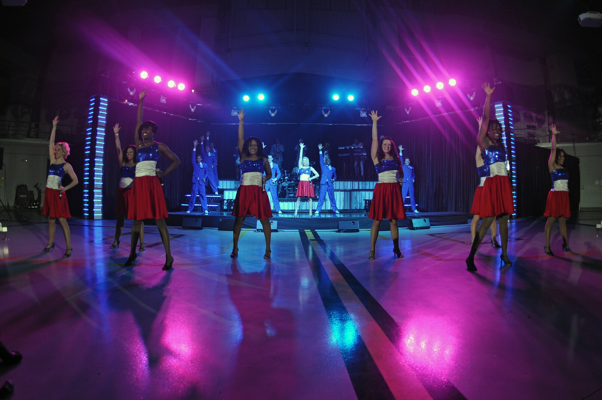 Members of Tops in Blue perform a dance routine during a live concert on Seymour Johnson Air Force Base, N.C., Jan. 7, 2013. The world tour is entitled “Listen,” and invites the audience to listen to the music of life through the sounds of everyday life. (U.S. Air Force photo/Airman 1st Class John Nieves Camacho/Released)