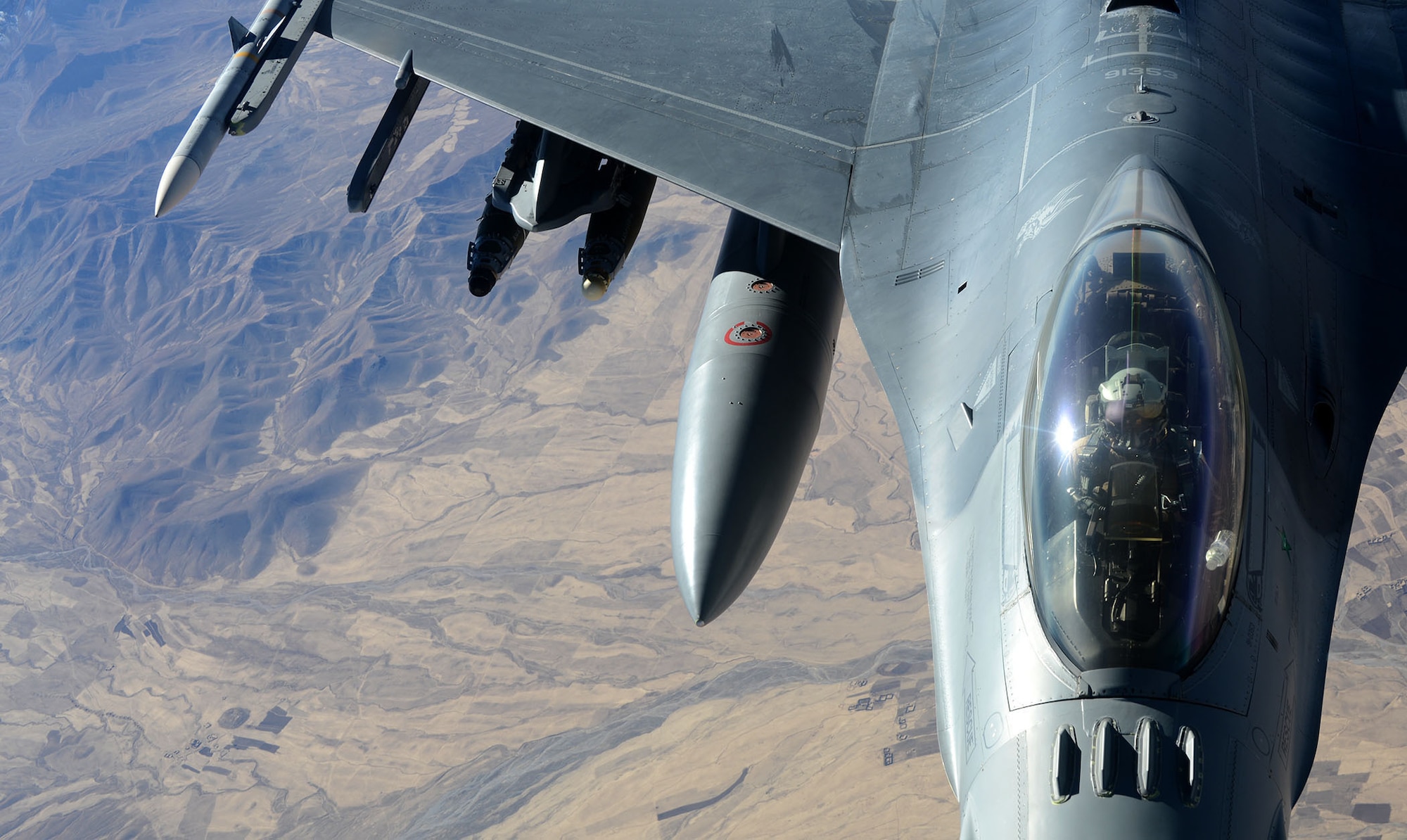 A 77th Fighter Squadron F-16 Fighting Falcon pilot, deployed to Kandahar Airfield, Afghanistan, prepares to receive fuel from a 340th Expeditionary Air Refueling Squadron KC-135 Stratotanker over Afghanistan, Dec. 22, 2012. Approximately 300 Airmen and 20 F-16 aircrafts deployed in support of Operation Enduring Freedom in November 2012. The F-16 Fighting Falcon received fuel in order to conduct close air support missions in support of OEF. (U.S. Air Force photo/Staff Sgt. Ashley Reed)