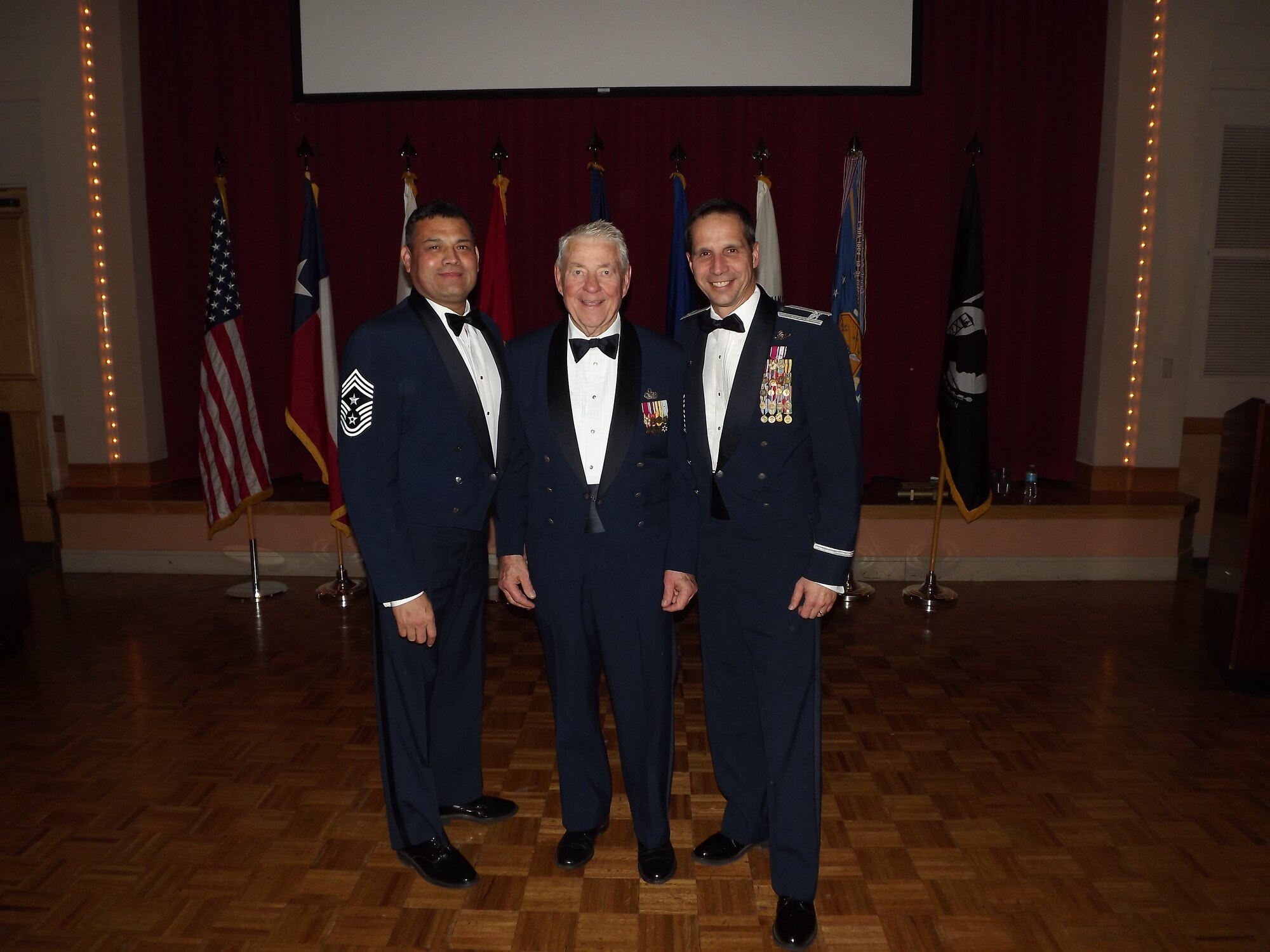 433rd Airlift Wing Command Chief Master Sgt. Emil Garza, Chief Master Sgt. (ret.) Robert Gaylor, and Col. Jeffrey T. Pennington, 433rd AW commander take a moment during the festivities of the Alamo Wing's annual awards banquet Jan. 5, 2013 on Joint Base San Antonio-Lackland, Texas. Chief Gaylor, the fifth Chief Master Sgt. of the Air Force, was the key-note speaker for the event. (U.S. Air Force Photo/Maj. Tim Wade)