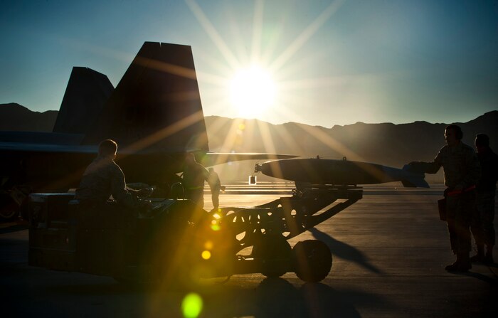 Aircraft armament systems Airmen from the 57th Aircraft Maintenance Squadron prepare to upload a guided bomb unit to an F-22 Raptor during a quarterly load crew competition, Jan. 4, 2013, at Nellis Air Force Base, Nev. The quarterly weapons load crew competition tests the skills of Airmen from Viper, Thunder, Raptor, Falcon, Eagle, Tomahawk and Strike Aircraft Maintenance Units. (U.S. Air Force Photo by Jason Couillard)