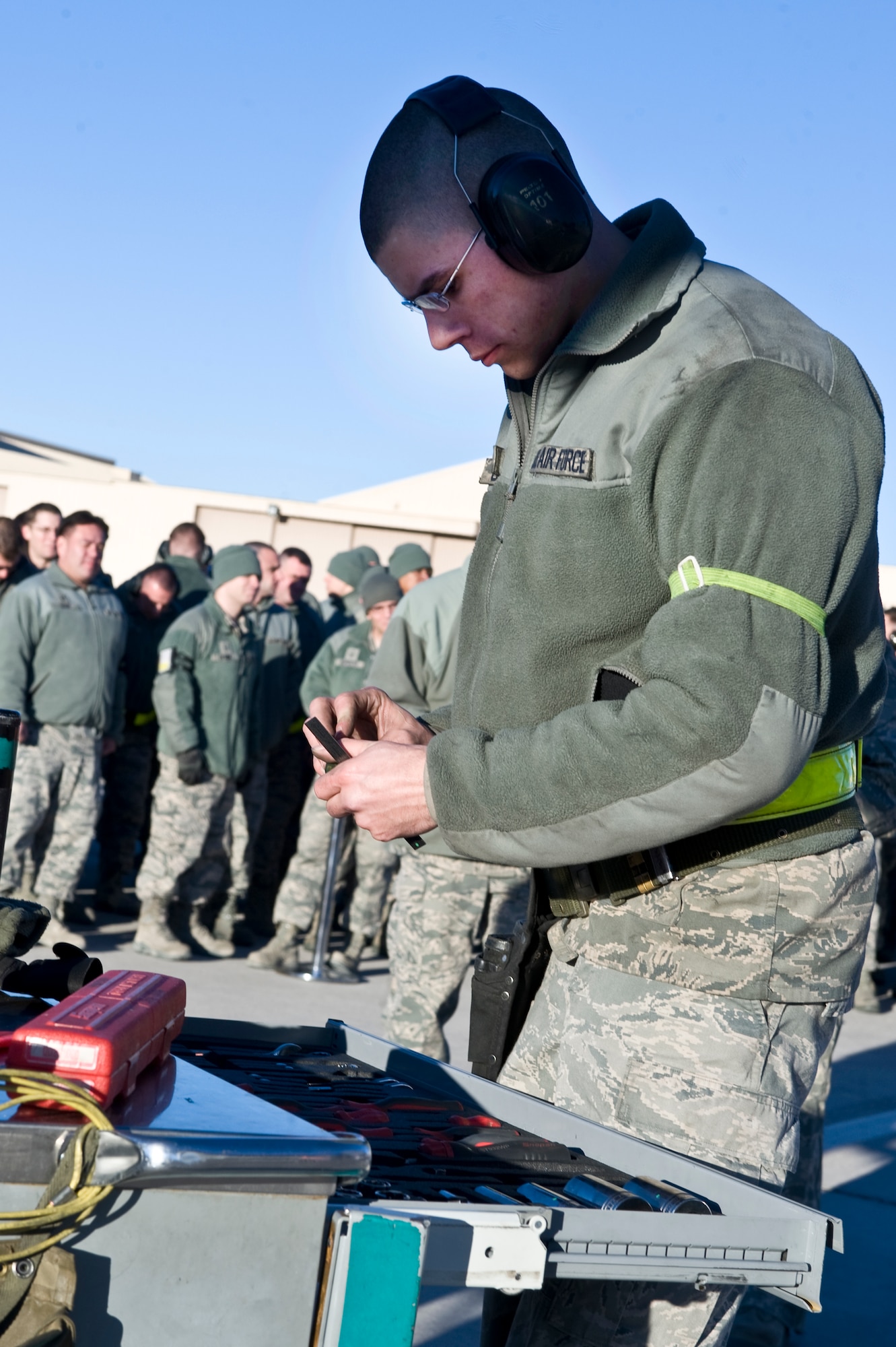 Airman 1st Class Francis Calhoun, 757th Aircraft Maintenance weapons load crew member, puts away tools during a quarterly load crew competition, Jan. 4, 2013, at Nellis Air Force Base, Nev. Every team's tool kit is inspected once they are done loading munitions. (U.S. Air Force photo by Senior Airman Matthew Lancaster)
