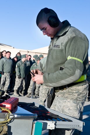 Airman 1st Class Francis Calhoun, 757th Aircraft Maintenance weapons load crew member, puts away tools during a quarterly load crew competition, Jan. 4, 2013, at Nellis Air Force Base, Nev. Every team's tool kit is inspected once they are done loading munitions. (U.S. Air Force photo by Senior Airman Matthew Lancaster)