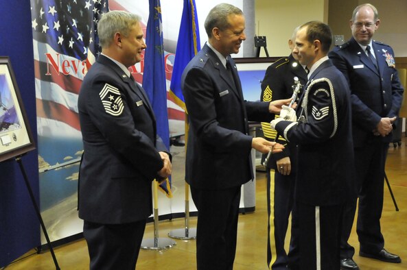 Nevada Air National Guard Command Chief Master Sgt. Rick Scurry, Brig. Gen. David Snyder, Staff Sgt. Bartley O'Toole, Command Sgt. Maj. Stephen Sitton and Brig. Gen. William Burks award the Nevada Air National Guard Outstanding Honor Guard Member of the Year 2012 to Staff Sgt. O'Toole during the NVANG's fourth annual Outstanding Airman of the Year Banquet  Saturday,  January 5, 2013, at the NVANG base, Reno, Nev.  (USAF Photo by Master Sgt. Suzanne Connell) (RELEASED)
