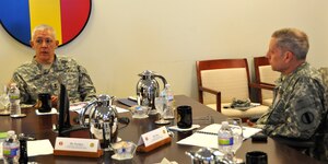 Maj. Gen. (Promotable) James L. Huggins Jr., incoming deputy chief of staff
G-3/5/7 at headquarters Department of the Army, meets with Brig. Gen. Pete
Utley, deputy chief of staff G-3/5/7 of U.S. Army Training and Doctrine
Command, Jan. 8, 2013, at Fort Eustis, Va. Huggins received updates on key
training initiatives and topics impacting TRADOC and the Army, a discussion
with leaders of the Army's Capability and Integration Center, and a site
visit to the Training Brain Operations Center. (U.S. Army photo by Sgt. 1st
Class Kelly Jo Bridgwater/Released)
