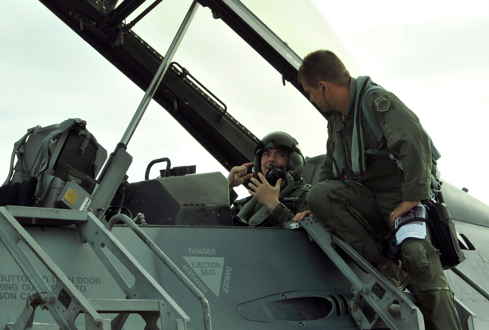 Air Force Academy Cadet Patrick Lobo (left) receives pre-flight instructions from Lt. Col. Adam Meyers, 93rd FS F-16 pilot, before takeoff for Lobo's F-16 orientation flight at Homestead Air Reserve Base, Fla., Dec. 21. Six Air Force Academy cadets, during their winter break, participated in orientation flights, flying in the backseat of an F-16 with pilots from the 93rd Fighter Squadron at Homestead Air Reserve Base, Fla., Dec. 17 through 21. Academy cadets are authorized an opportunity to ride on certain aircraft, Air Force wide, during a regularly scheduled training mission as a way of familiarizing them with the occupational Air Force. (U.S. Air Force photo/Senior Airman Jaimi Upthegrove)