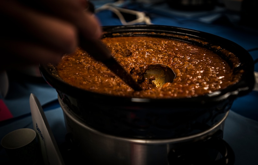 A judge ladles chili during the Commanders Chili Cook-off Jan. 4, 2012, at Joint Base Charleston – Air Base, S.C. Commanders from several JB Charleston commands participated by bringing in their own style of chili and opened the event for Airmen to sample their creations. All proceeds from the cook-off went to Airmen Against Drunk Driving. (U.S. Air Force photo/Airman 1st Class Tom Brading)