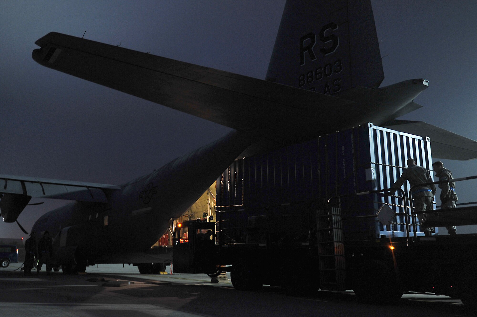 Members of the 86th Aircraft Maintenance Squadron and the 37th Airlift Squadron help load cargo onto a C-130J Super Hercules on the flightline at Ramstein Air Base, Germany, Jan. 7, 2013. The 86th Airlift Wing provides support to the NATO led coalition that will augment Turkey's air defense capabilities and contribute to the de-escalation of the crisis along the border. (U.S. Air Force photo/Airman 1st Class Holly Cook)