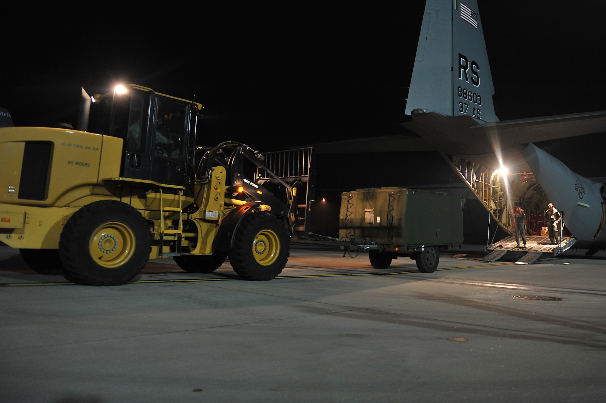 Members of the 86th Aircraft Maintenance Squadron and the 37th Airlift Squadron help load cargo onto a C-130J Super Hercules on the flightline at Ramstein Air Base, Germany, Jan. 7, 2013. The 86th Airlift Wing provides support to the NATO led coalition that will augment Turkey's air defense capabilities and contribute to the de-escalation of the crisis along the border. (U.S. Air Force photo/Airman 1st Class Holly Cook)