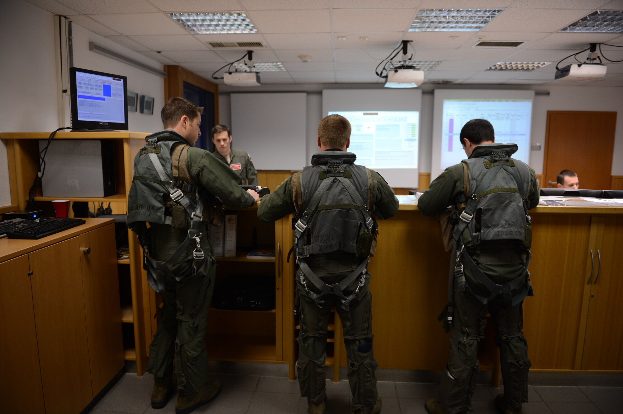 SPANGDAHLEM AIR BASE, Germany – F-16 Fighting Falcon fighter pilots from the 480th and 555th Fighter Squadrons receive a final flight brief before flying to the United States for a training exericse Jan. 5, 2013. The 480th and 555th are training together along with allied nations for Red Flag 13-2 at Nellis Air Force Base, Nev. The 555th FS is from Aviano Air Base, Italy. (U.S. Air Force photo by Staff Sgt. Nathanael Callon/Released)