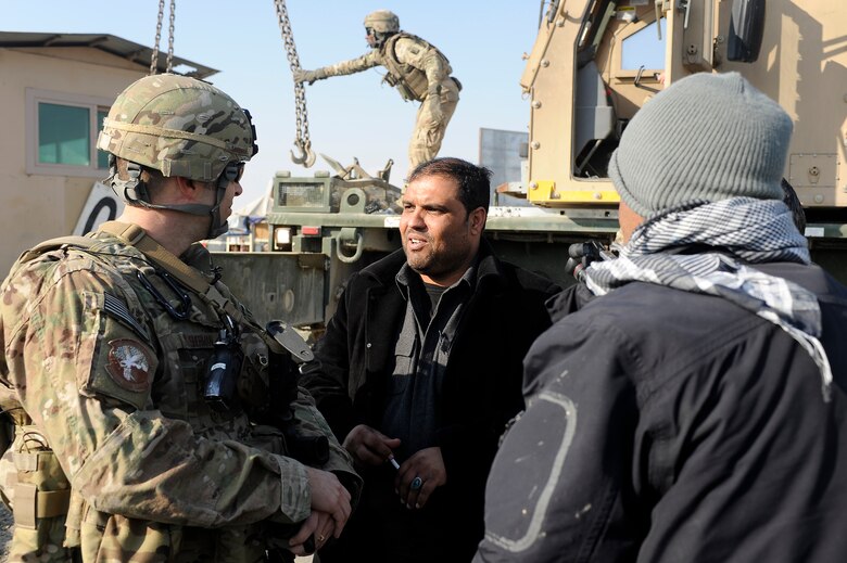 Lt. Col. Thomas Sherman, 455th Expeditionary Security Forces Squadron commander, and Col. Uzmari, Afghan National Police Bagram District chief, discuss future joint operations in Bagram District, Jan. 6, 2013. Airmen from the 455th Expeditionary Security Forces Group teamed with the Army’s 857th Engineer Company and local ANP forces to transfer an armored guard post from Bagram to a nearby ANP checkpoint. (U.S. Air Force photo/Capt. Erika Yepsen)