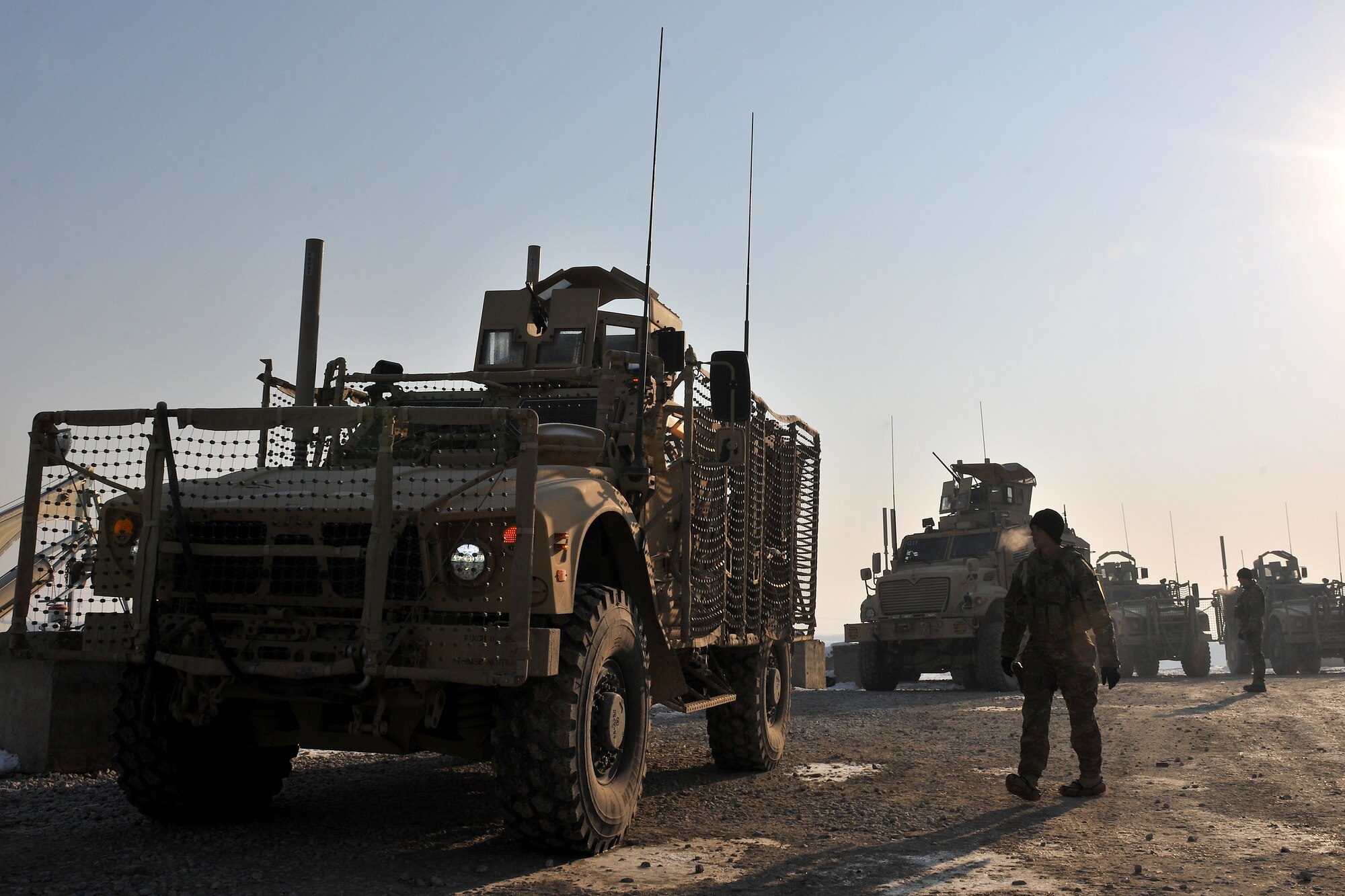 Airmen of the755th Expeditionary Security Forces Squadron Reaper Team 1 prepare to mount up for an early morning mission at Bagram Airfield, Afghanistan, Jan. 1, 2013. This group of security forces Airmen operated a mission “outside the wire” providing security during a key leader engagement in the local community. (U.S. Air Force photo/Senior Airman Chris Willis)