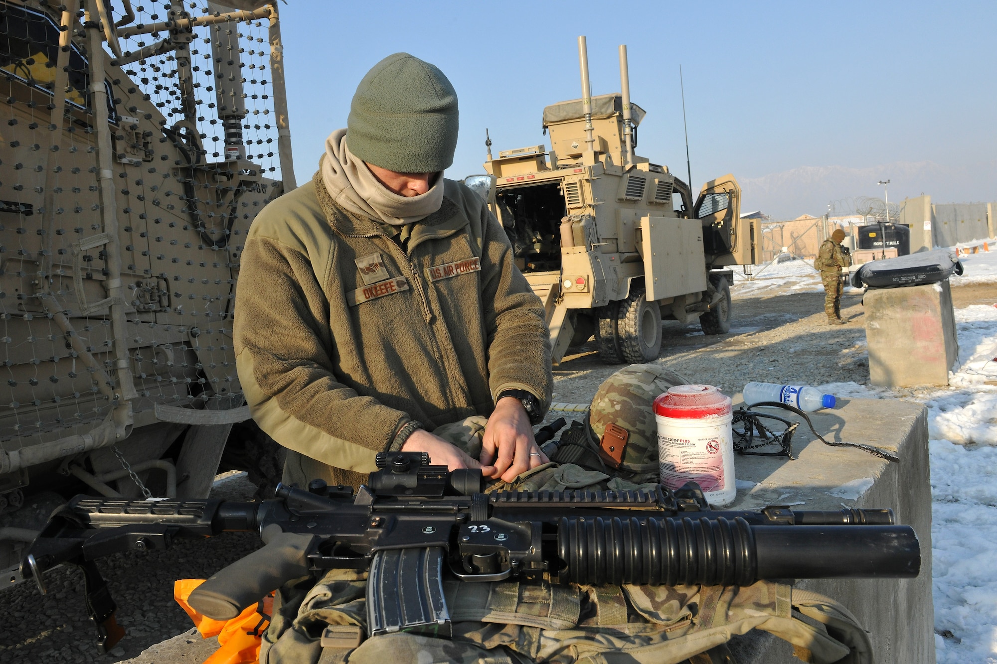 Senior Airman Sean O’Keefe, 755th Expeditionary Security Forces Squadron, prepares his weapon prior to an early morning mission “outside the wire” with Reaper Team 1 at Bagram Airfield, Afghanistan, Jan. 1, 2013. The Reaper teams perform various security patrols both on and off the installation. (U.S. Air Force photo/Senior Airman Chris Willis)
