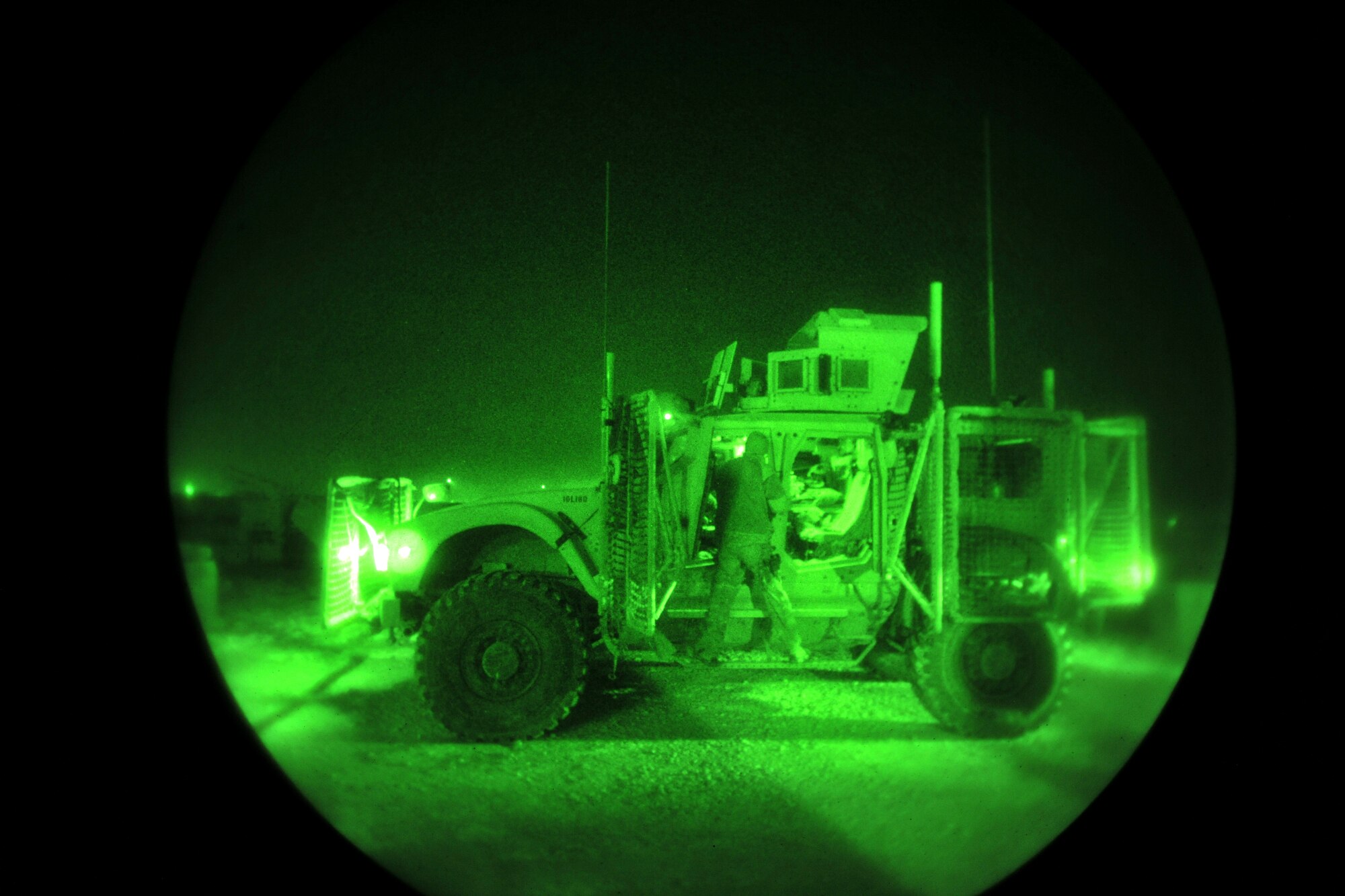 Staff Sgt. Christopher Madden, 755th Expeditionary Security Forces Squadron, prepares his vehicle before an early morning mission at Bagram Airfield, Afghanistan, Jan. 1, 2013. This group of security forces Airmen operated a mission “outside the wire” providing security during a key leader engagement in the local community. (U.S. Air Force photo/Senior Airman Chris Willis)