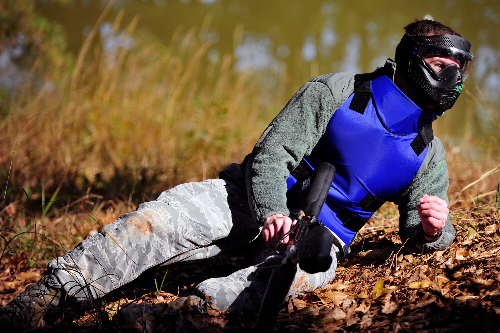1st Lt. David Nugent, 51st Security Forces Squadron defender, goes down after being hit by a paintball in a joint training exercise Nov. 1, 2012. Members from the Republic of Korean Army 4th Battalion 169th Regiment hosted the joint training to help the units learn how to work together in a ground attack.  (U.S. Air Force photo/Airman 1st Class Alexis Siekert)