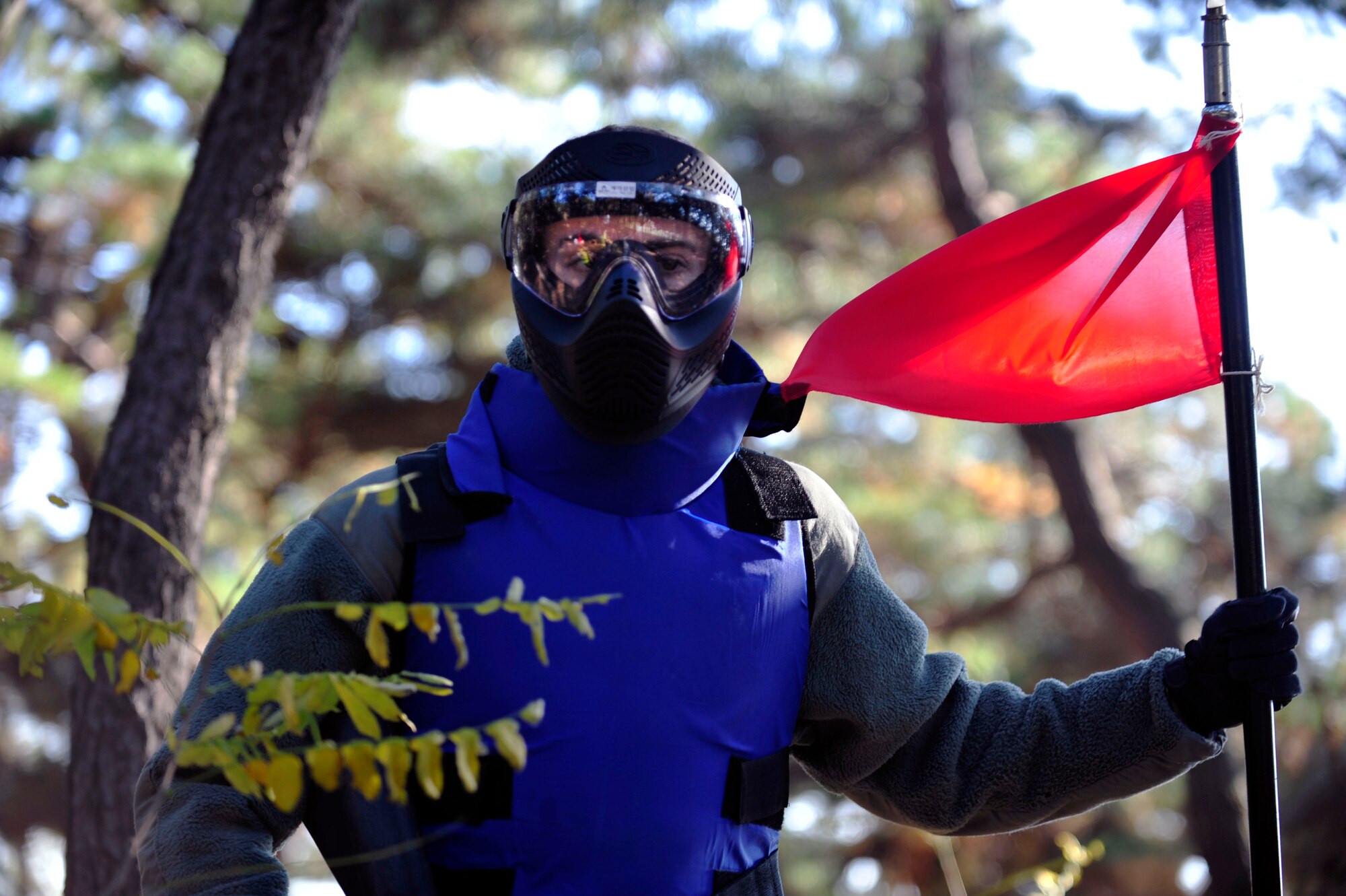 Airman 1st Class Stephen Brindle, 51st Security Forces Squadron defender and Quick Reaction Team member, captures the flag in a joint training paintball exercise Nov. 1, 2012. Teams integrated U.S. Airmen and Soldiers with the Republic of Korean Army 4th Battalion 169th to familiarize themselves with combined war-fighting tactics. (U.S. AirForce photo/Airman 1st Class Alexis Siekert)
