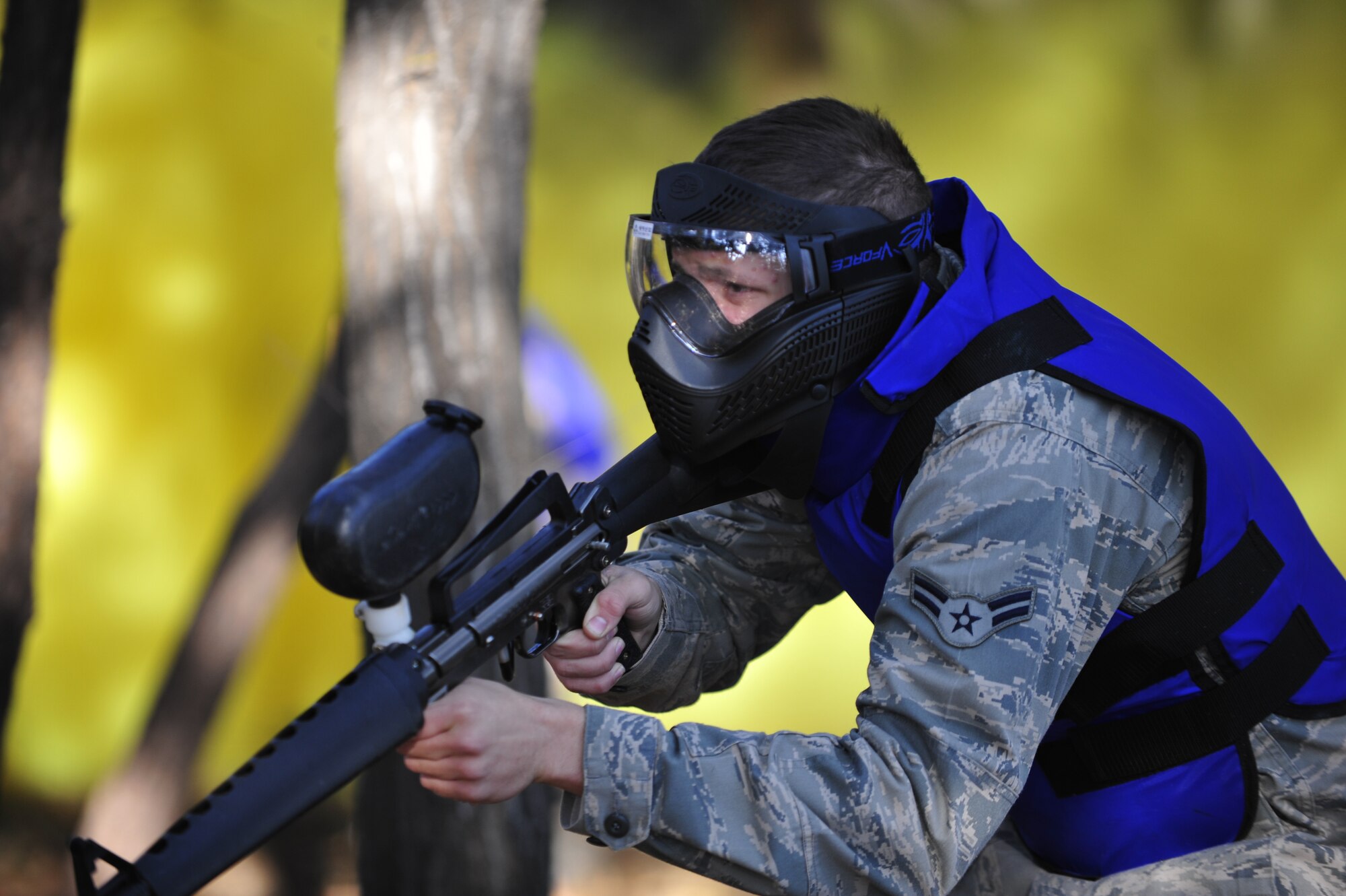 Airman 1st Class Zachary Washington, 51st Security Forces Squadron defender and Quick Reaction Team member, takes aim in a joint training paintball exercise Nov. 1, 2012. The training helped familiarize tactics from both units by integrating teams for a friendly, competitive game of capture the flag. (U.S. Air Force photo/Airman 1st Class Alexis Siekert)