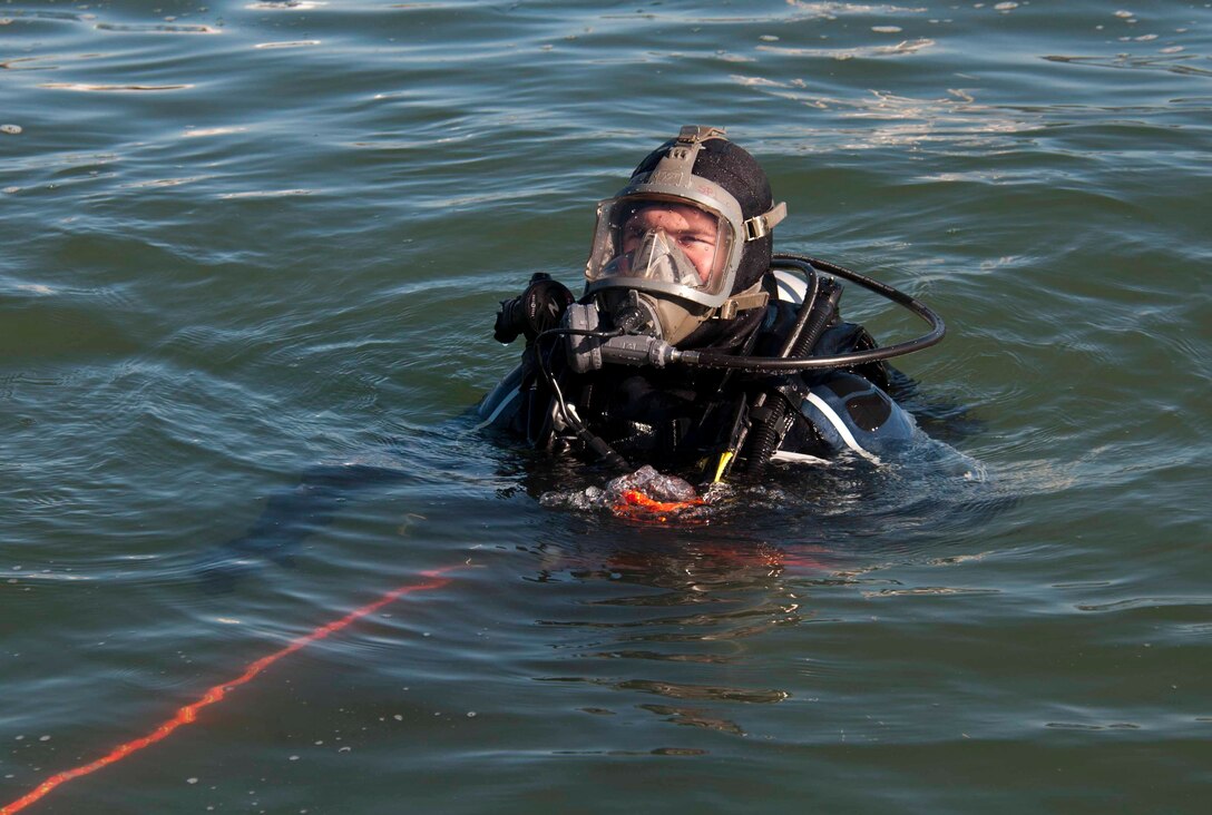 Joshua Burkhead tests his equipment prior to his first dive.
