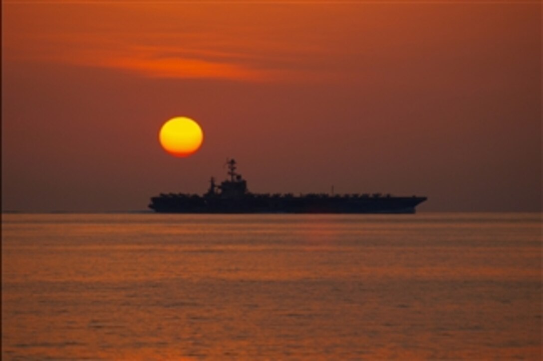 The aircraft carrier USS John C. Stennis (CVN 74) operates in the Arabian Sea during sunset on Jan. 5, 2013.  The John C. Stennis Strike Group is deployed to the 5th Fleet area of responsibility to conduct maritime security operations and theater security cooperation efforts.  