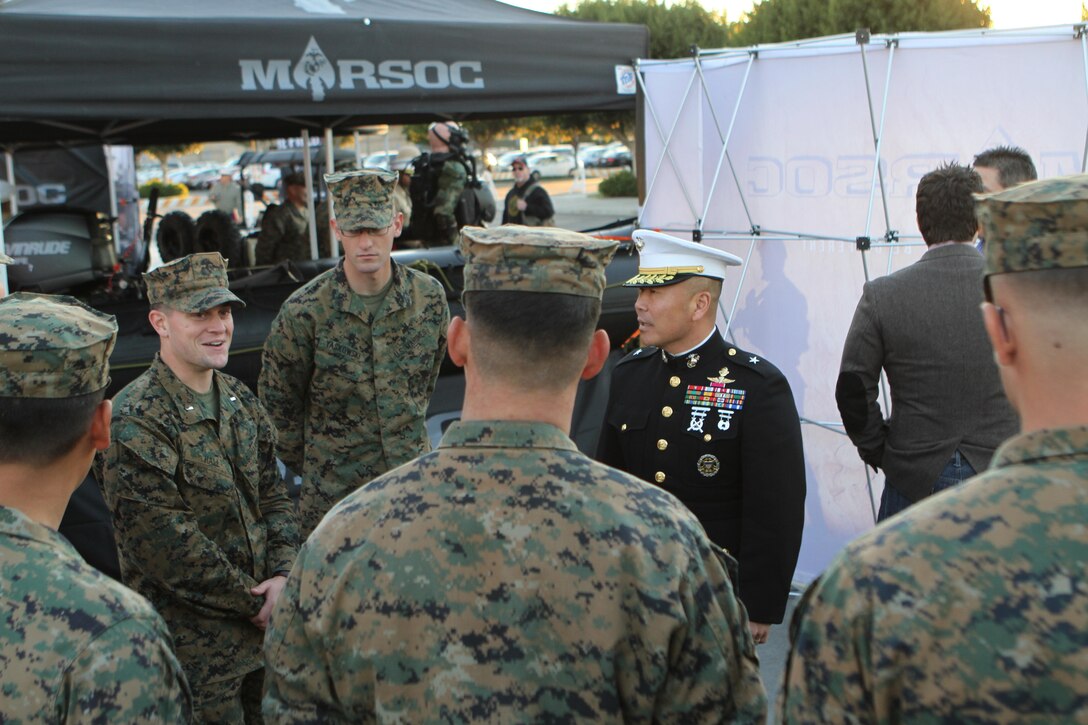 BGen. Daniel Yoo, commanding general, Marine Corps Recruit Depot San Diego and the Western Recruiting Region, took time to visit with Marines who came out to support of the Semper Fidelis All-American Bowl Fan Fest set up right outside the main gates of The Home Depot Center, Carson, Calif.  The fan fest had a Pull-up Bar Challenge, a Marine Special Operations Command booth, static displays and a special performance by a few members of the Marine Band San Diego. (U.S. Marine Corps Photo by Sgt. Frances Johnson)