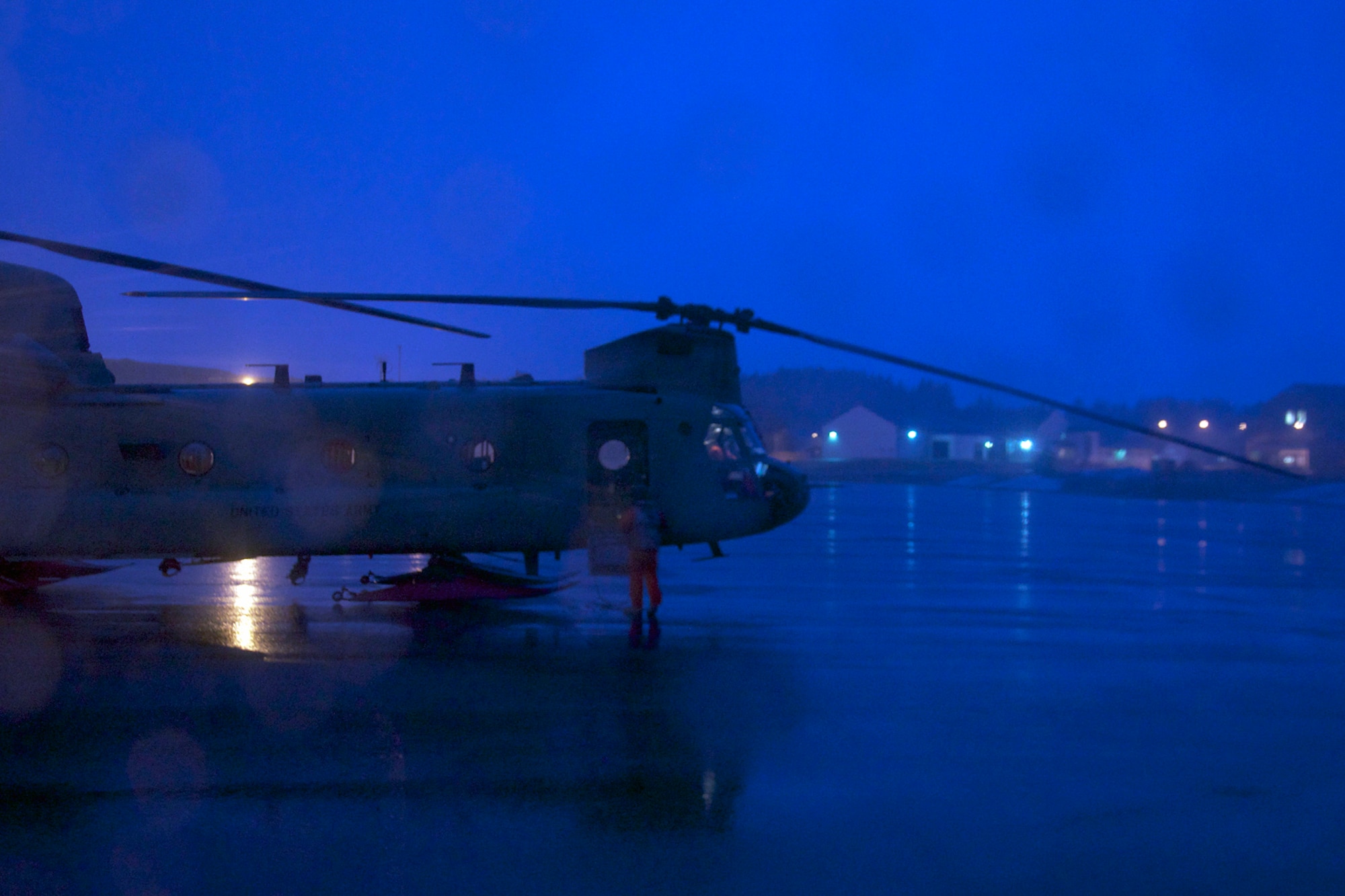 Crewmembers prepare one of the two CH-47F Chinook helicopters from B Company, 1st Battalion, 52nd Aviation Regiment for flight Jan. 6. The two helicopters and crews flew to Kodiak on a mission to help the grounded oil rig Kulluk by hauling equipment to and from the rig. (U.S. Air Force photo/SSgt. Aaron M. Johnson)