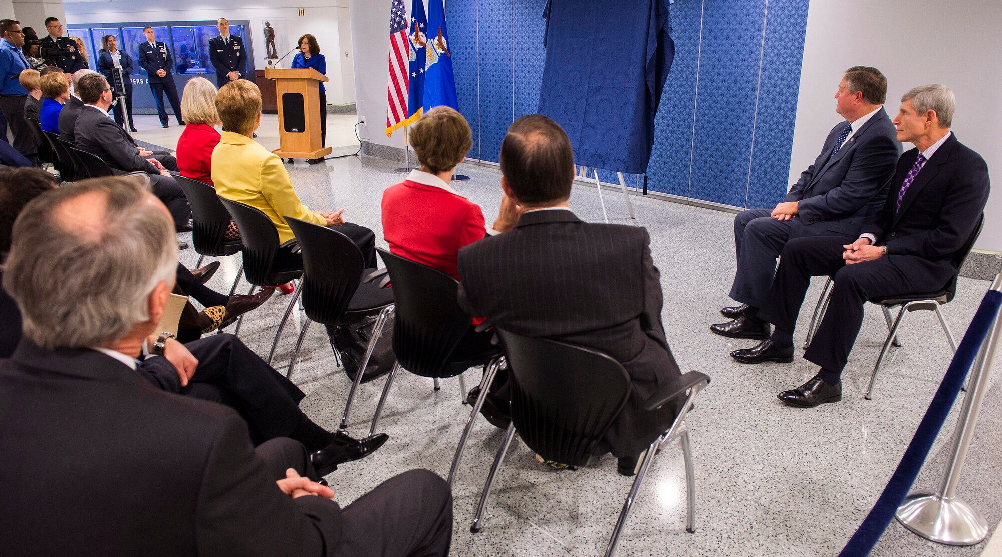 Artist Michele Rushworth talks about the approach she used to paint the official portrait of former Air Force Chief of Staff retired Gen. Norton Schwartz before its unveiling in the Pentagon, Washington, D.C., on Jan. 8, 2013. The portrait will be on display in the Pentagon's Arnold Corridor alongside the portraits of all the other former Air Force Chiefs of Staff. (U.S. Air Force photo/Jim Varhegyi)