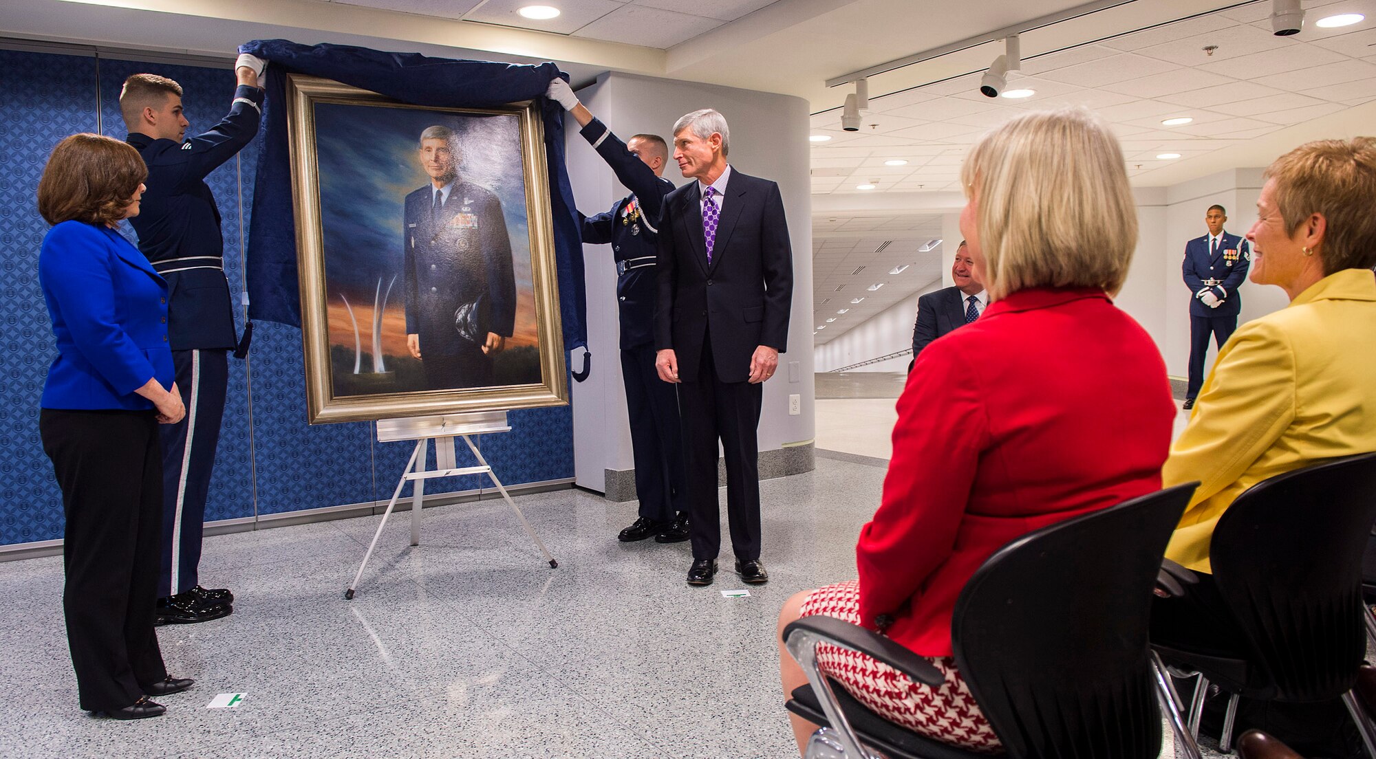 Retired Gen. Norton Schwartz and artist Michele Rushworth look on as the former chief of Staff of the Air Force’s official portrait is unveiled in the Pentagon, Washington, D.C., on Jan. 8, 2013. The portrait will be on display in the Pentagon's Arnold Corridor alongside the portraits of the other former Air Force chiefs of staff. (U.S. Air Force photo/Jim Varhegyi)