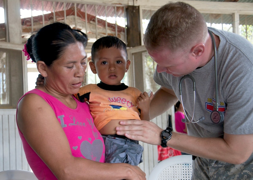 Maj. (Dr.) Robert Jones, JTF-B Flight Surgeon, conducts an examination on a young boy during the four-day joint medical readiness training exercise in Chiquimula, Guatemala Dec. 12. MEDRETEs help cultivate common bonds and foster goodwill between the U.S. and regional nations through multilateral humanitarian assistance and civil military operations. (U.S. Air Force photo/Staff Sgt. Eric Donner)