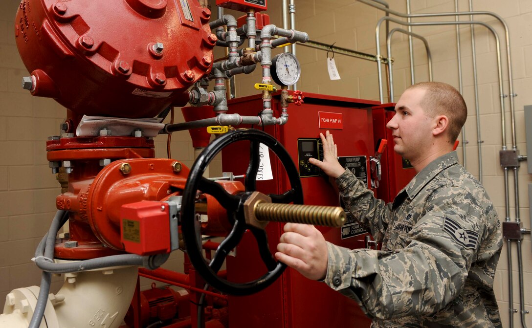 Staff Sgt. David Overstreet, 28th Civil Engineer Squadron water fuels systems maintenance, ensures proper valve position on a high expansion foam system at the Petroleum Oil Liquids Control Facility on Ellsworth Air Force Base, S.D., Dec. 19, 2012. Working in water fuels systems maintenance, Overstreet installs, inspects, repairs, and manages the many water systems on base, including plumbing, water distribution, wastewater collection, and fire suppression systems. (U.S. Air Force photo by Airman 1st Class Anania Tekurio/Released) 
