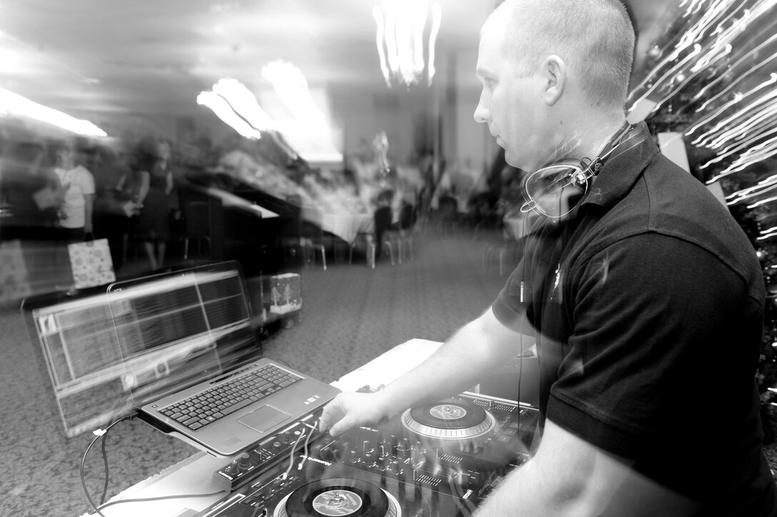 Staff Sgt. David Overstreet, 28th Civil Engineer Squadron water fuels systems maintenance, deejays music during the 28th CES Christmas party at the Dakota’s Club on Ellsworth Air Force Base, S.D., Dec. 14, 2012. Overstreet, known as DJ “Street” to his audiences, has always had a passion for music and upon his return from a recent deployment, began to learn the art of disc jockeying. (U.S. Air Force photo by Airman 1st Class Anania Tekurio/Released) 