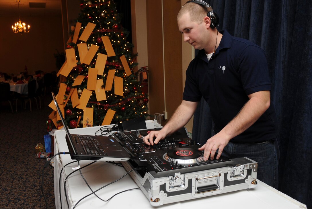 Staff Sgt. David Overstreet, 28th Civil Engineer Squadron water fuels systems maintenance, plays music during the 28th CES Christmas party at the Dakota’s Club on Ellsworth Air Force Base, S.D., Dec. 14, 2012. Overstreet, known as DJ “Street,” has pursued learning and performing the art of disc jockeying. (U.S. Air Force photo by Airman 1st Class Anania Tekurio/Released)  