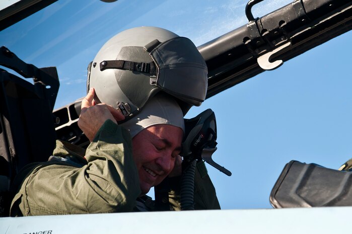 Mr. Scott Gragson, 57th Adversary Tactics Group honorary commander, dons a flight helmet before an orientation flight Jan. 4th, 2012, at Nellis Air Force Base, Nev. Gragson flew in an F-15 Eagle over the Nevada Test and Training Range. (U.S. Air Force photo by Senior Airman Brett Clashman)