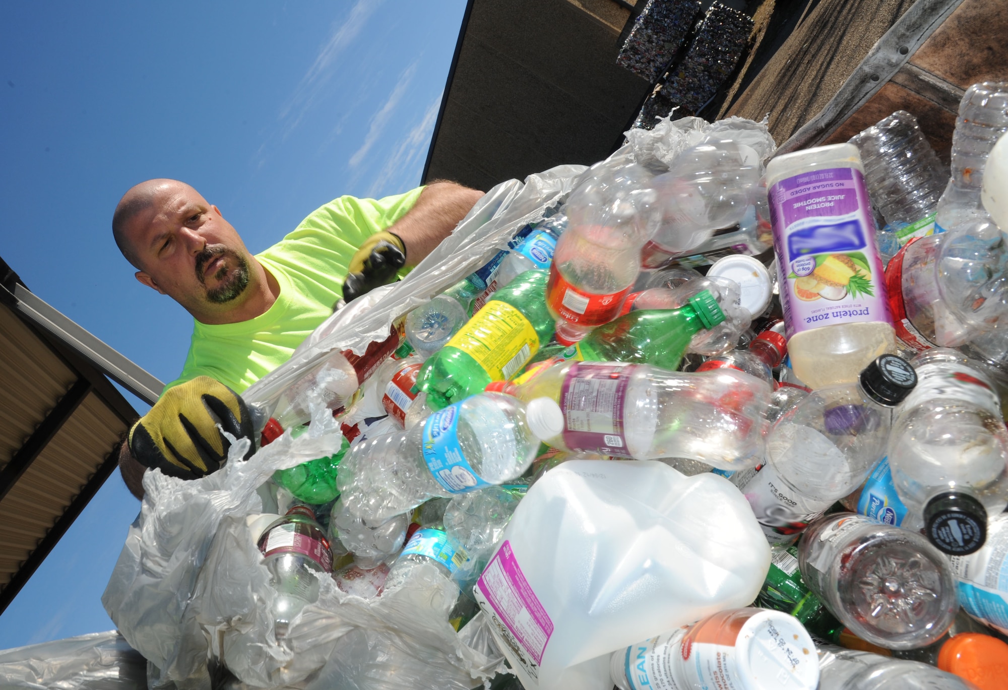 Duane Olsen, recycling center contractor, separates plastic and aluminum materials into different bins. Keesler’s recycling center recently won the Environmental Hero Award, Recycler of the Year in the state and federal government category from the Mississippi Recycling Coalition. In fiscal year 2012, the center recycled 2,383 tons of materials including 323.45 tons of food waste, a unique effort in south Mississippi. This effort saved $99,555.44 from going to landfills and resulted in $180,119 of revenue being returned to the base. (U.S. Air Force photo by Kemberly Groue