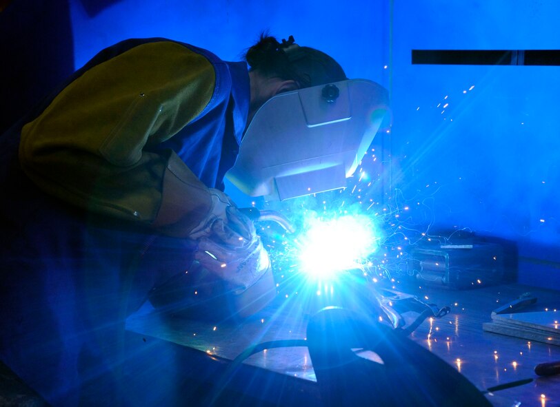 Staff Sgt. Elizabeth Germain, 2nd Maintenance Squadron fabrication flight, welds machine rollers on Barksdale Air Force Base, La., Jan. 9. The 2 MXS fabrication flight is able to produce aircraft parts and tools from raw metal in order to support Barksdale's mission of delivering precision munitions to the battlefield. (U.S. Air Force photo/Airman 1st Class Andrew Moua)