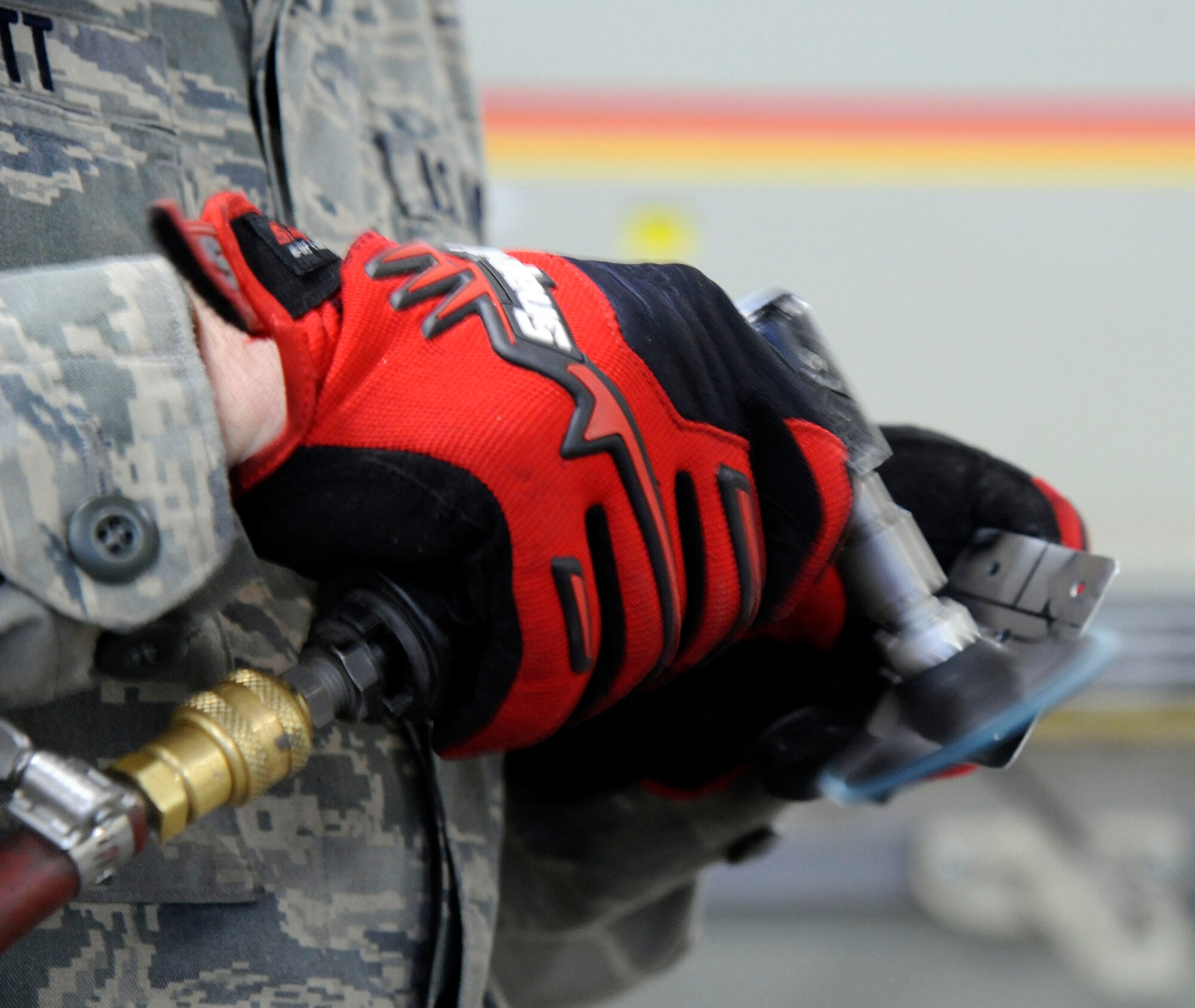 Airman 1st Class David Schlott, 2nd Maintenance Squadron fabrication flight, cleans a filler during engine cowling repairs on Barksdale Air Force Base, La., Jan. 9. Fillers help secure rivets in place when installed on a B-52H Stratofortress bomber's engine cowlings by providing a backing where rivets can attach to. (U.S. Air Force photo/Airman 1st Class Andrew Moua)