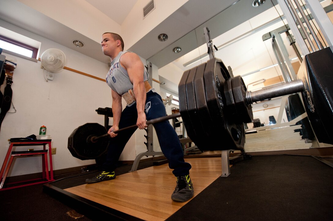 Senior Airman Brandon Stout, 28th Civil Engineer Squadron fire and emergency services driver operator, deadlifts 505 pounds at the fire station on Ellsworth Air Force Base, S.D., Jan. 8, 2013. Stout has won four power lifting championships and has set his sights on competing to win the 21st Annual U.S. Military Power Lifting Championship in March 2013. (U.S. Air Force photo by Airman 1st Class Zachary Hada/Released)