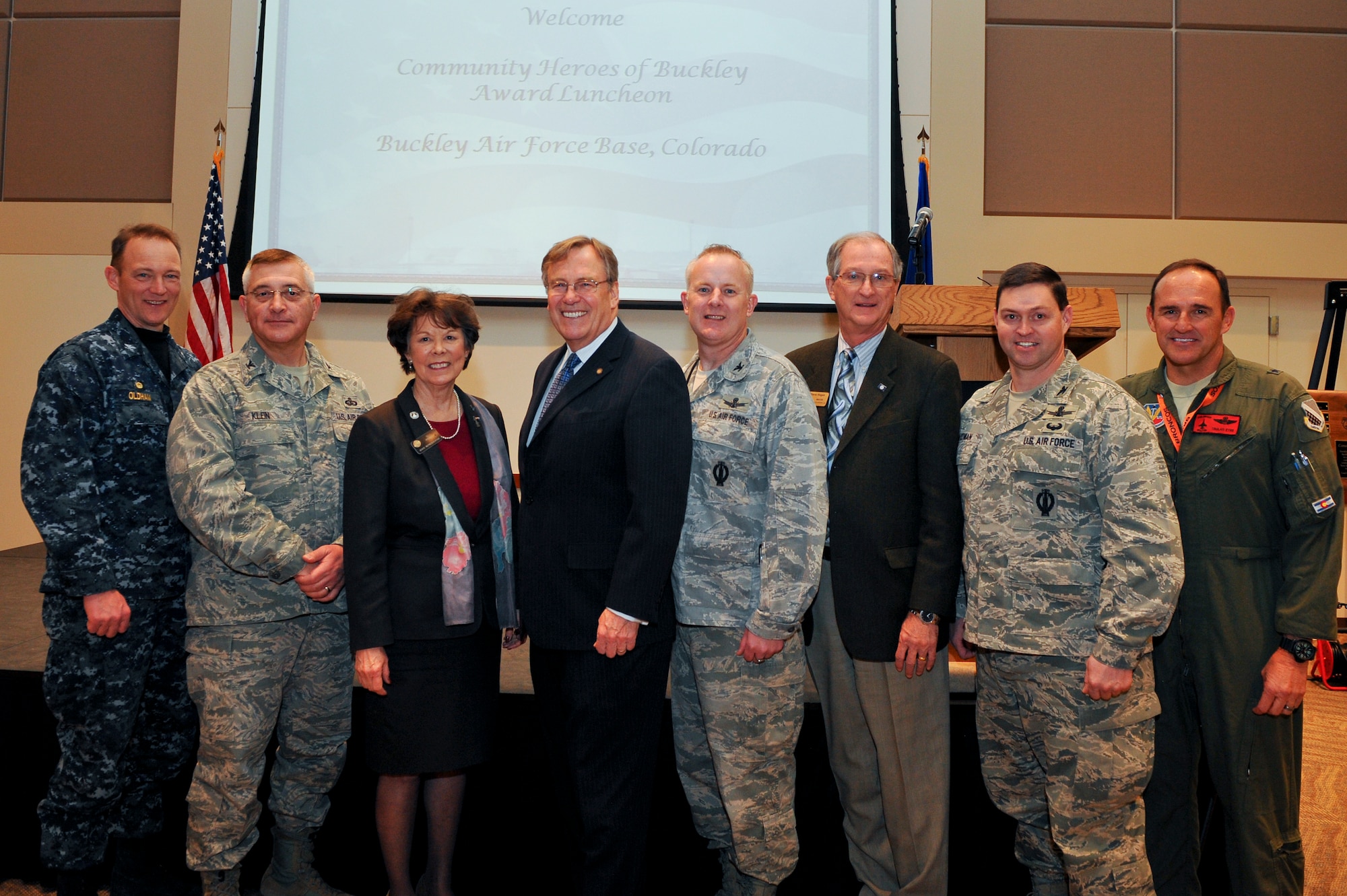 BUCKLEY AIR FORCE BASE, Colo. – Community and Buckley leaders stand with award recipients Jan. 8, 2013, at the Leadership Development Center during the Community of Heroes Luncheon.  Hero of Buckley award recipients are community members who through their continued support and dedication, strive to enhance the base and quality of life for military families.(U.S. Air Force Photo by Airman 1st Class Phillip Houk)