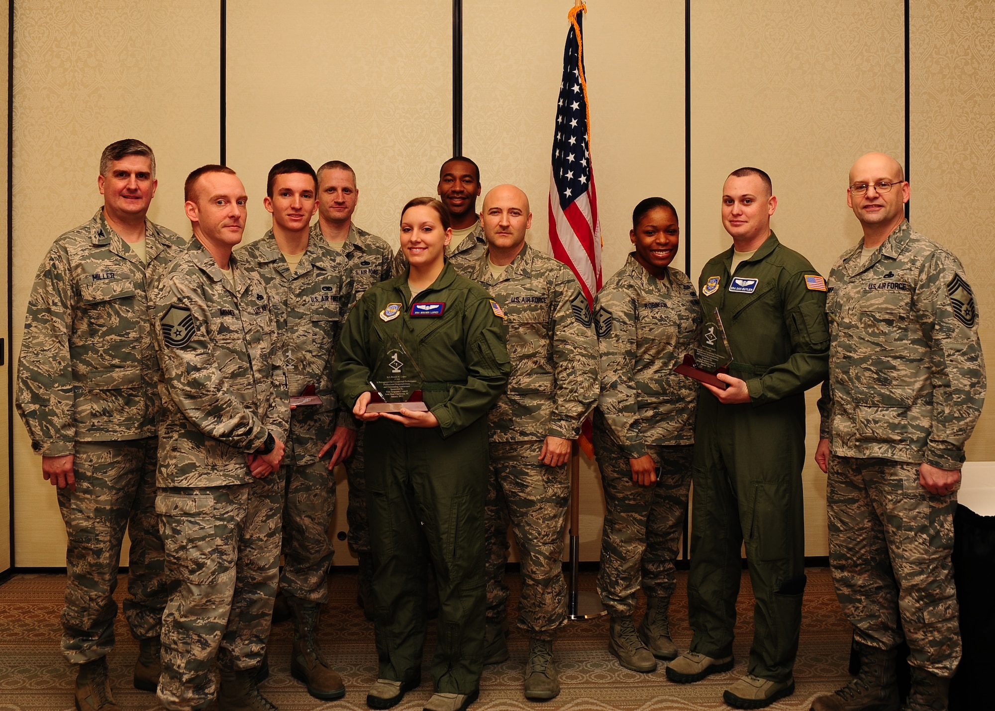 Diamond Sharp award winners and their first sergeants gather after the Diamond Sharp ceremony Jan. 8, 2012 at Joint Base Charleston - Air Base, S.C. Diamond Sharp awards recognize individuals in a unit who stand out to their first sergeant. (U.S. Air Force photo/ Airman 1st Class Chacarra Walker)