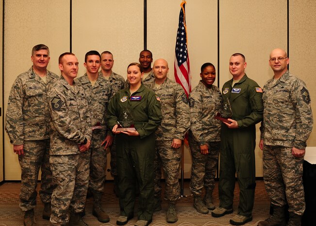 Diamond Sharp award winners and their first sergeants gather after the Diamond Sharp ceremony Jan. 8, 2012 at Joint Base Charleston - Air Base, S.C. Diamond Sharp awards recognize individuals in a unit who stand out to their first sergeant. (U.S. Air Force photo/ Airman 1st Class Chacarra Walker)