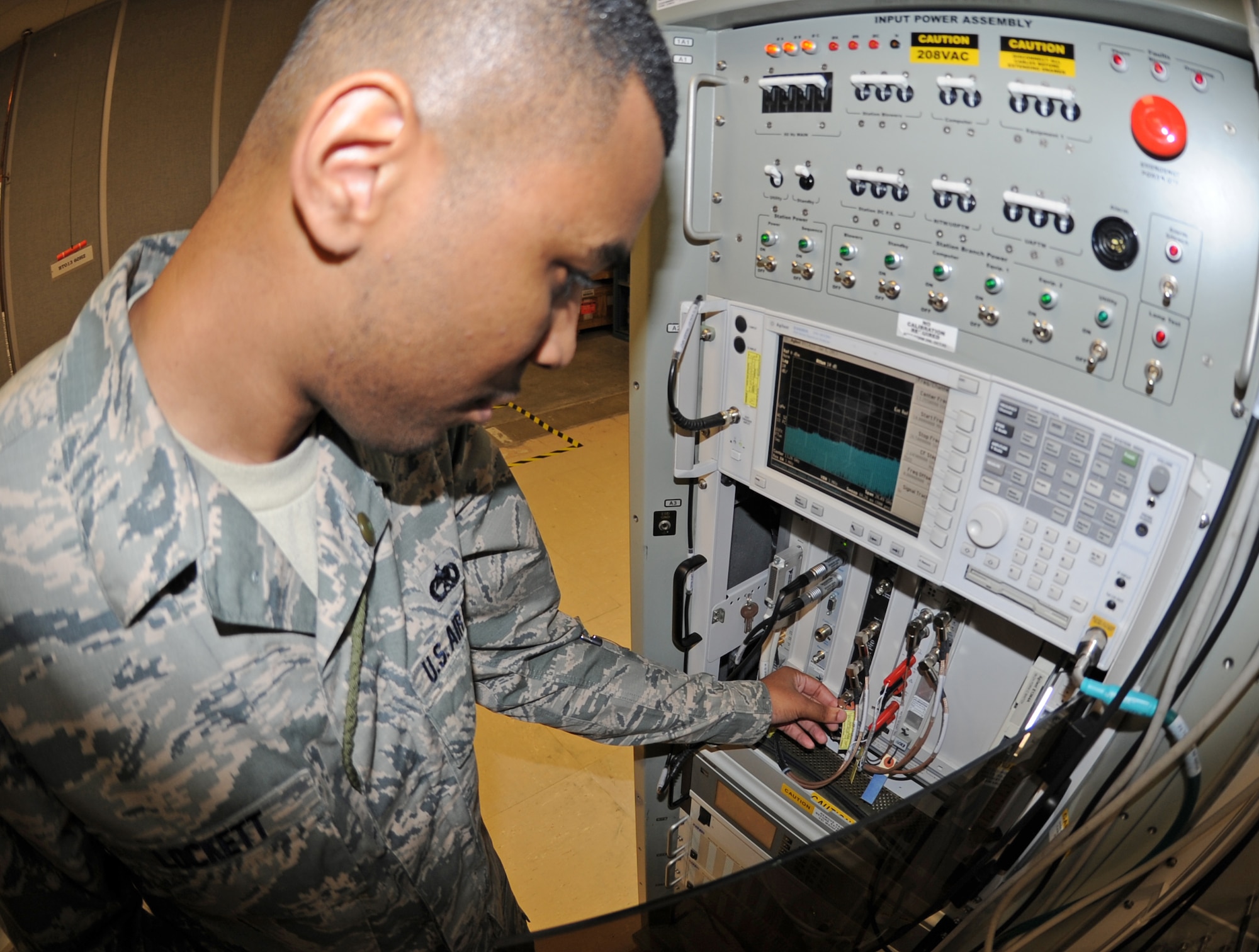 U.S. Air Force Staff Sgt. Demarcus Lockett, 4th Component Maintenance Squadron intermediate avionics specialist, conducts alignments on a low band receiver on Seymour Johnson Air Force Base, N.C., Jan. 8, 2013. The avionics shop performs maintenance on F-15E Strike Eagle electronic components to include displays, radar, navigation and electronic warfare. (U.S. Air Force photo/Airman 1st Class Gino Reyes/Released)