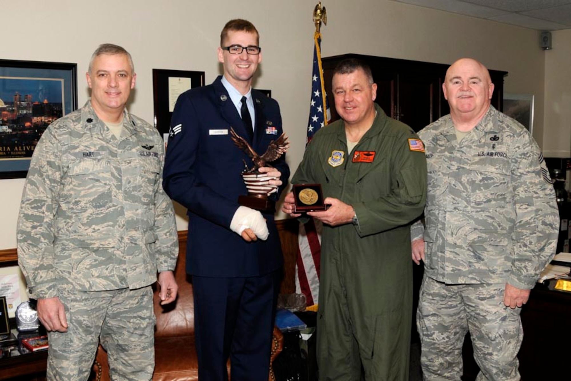 The 2013 Illinois Outstanding Airman of Year award was presented to Senior Airman Alexander Corwin on January 6th, 2013.  Airman Corwin is a traditional Guardsman with the 182nd Maintenance Squadron, 182nd Airlift Wing, at the Peoria Air National Guard Base.  Airman Corwin currently serves as an Airlift Instrument Flight Control Systems Craftsman at the Peoria Air National Guard Base.  Present to bestow the award to him were Colonel William Robertson, Wing Commander; Lieutenant Colonel Robert Hart, Vice Commander; and Chief Master Sergeant Stephen Eakle, Command Chief.  (U.S. Air Force photo by Tech. Sgt. Todd Pendleton/Released)