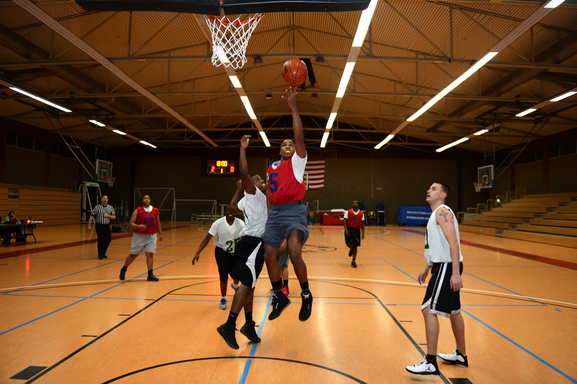 SPANGDAHLEM AIR BASE, Germany – Laron Mayfield, 52nd Communications Squadron, does a layup during a basketball game against the 52nd Civil Engineer Squadron inside the Skelton Memorial Fitness Center Jan. 8, 2013. The 52nd CS led the first half 19- 16. (U.S. Air Force photo by Airman 1st Class Gustavo Castillo/Released)