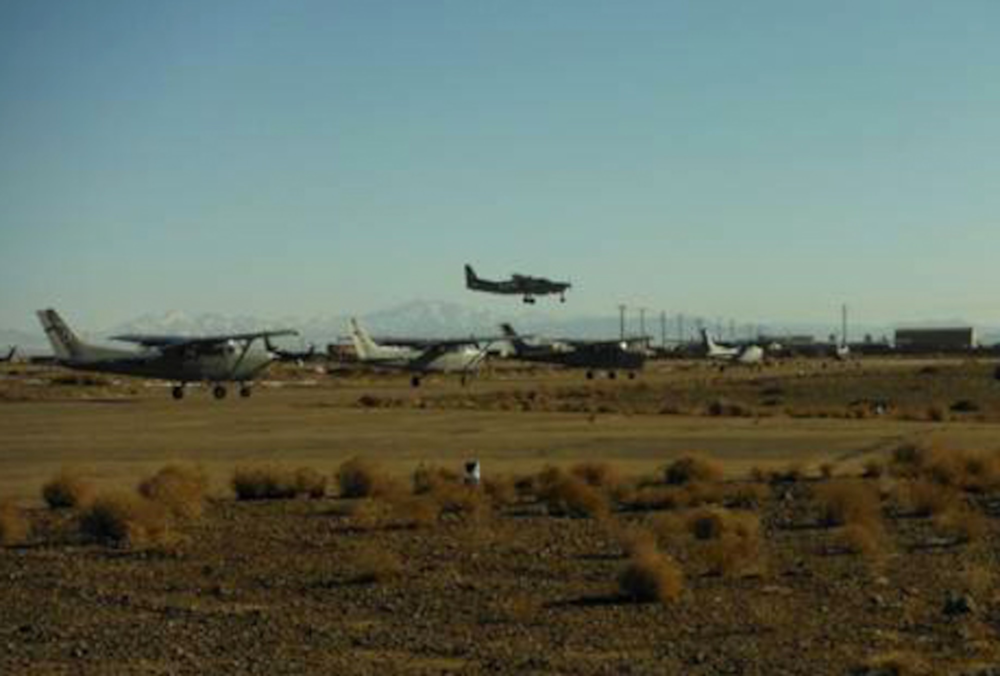 Student pilots wait for taxi and takeoff in Cessna 208Bs along the flightline of Shindand Air Base, Afghanistan, Dec. 29, 2012. Students of the AAF Undergraduate Pilot Training Class 12-03 completed each of their first Cessna 208B flights at Shindand Air Base, western Afghanistan, marking the start of the advanced training phase of UPT for the second such class taking place in country after more than 30 years. (Courtesy photo)
