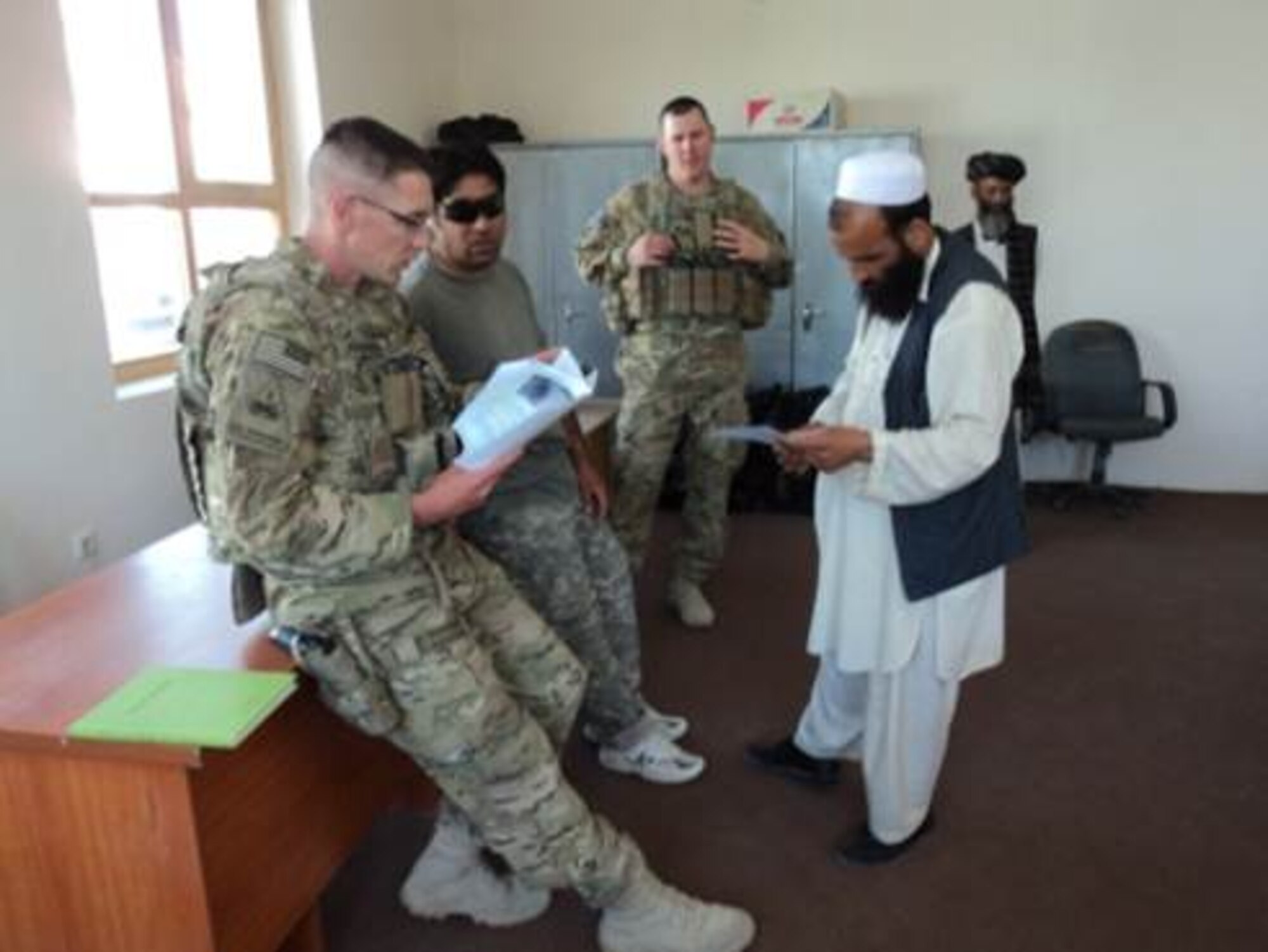 LOGAR PROVINCE, Afghanistan -- Tech. Sgt.  Kody Jorgensen and Staff Sgt. Zachery Williams, both veterinary technicians for livestock animals, teach local Afghans techniques on hoof care, castration and sheering for domestic animals.  The goal of the ADT is to increase agriculture productivity by increasing farmers’ access to inputs and effective services while increasing the Afghans’ confidence in their local government.  (courtesy photo)